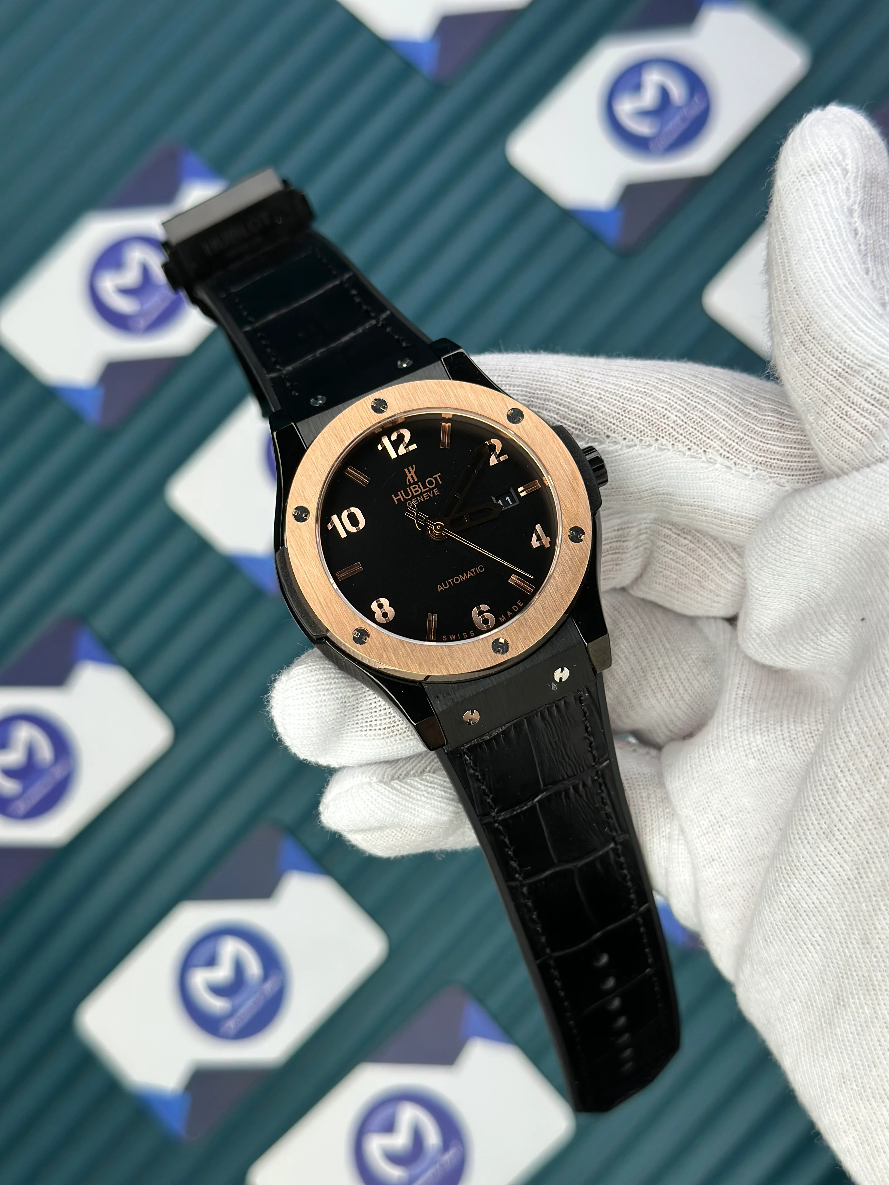 HUBLOT GENEVE AUTOMATIC VENDOME BLACK DIAL ROSE BEZEL BLACK CASE BLACK LEATHER CORD