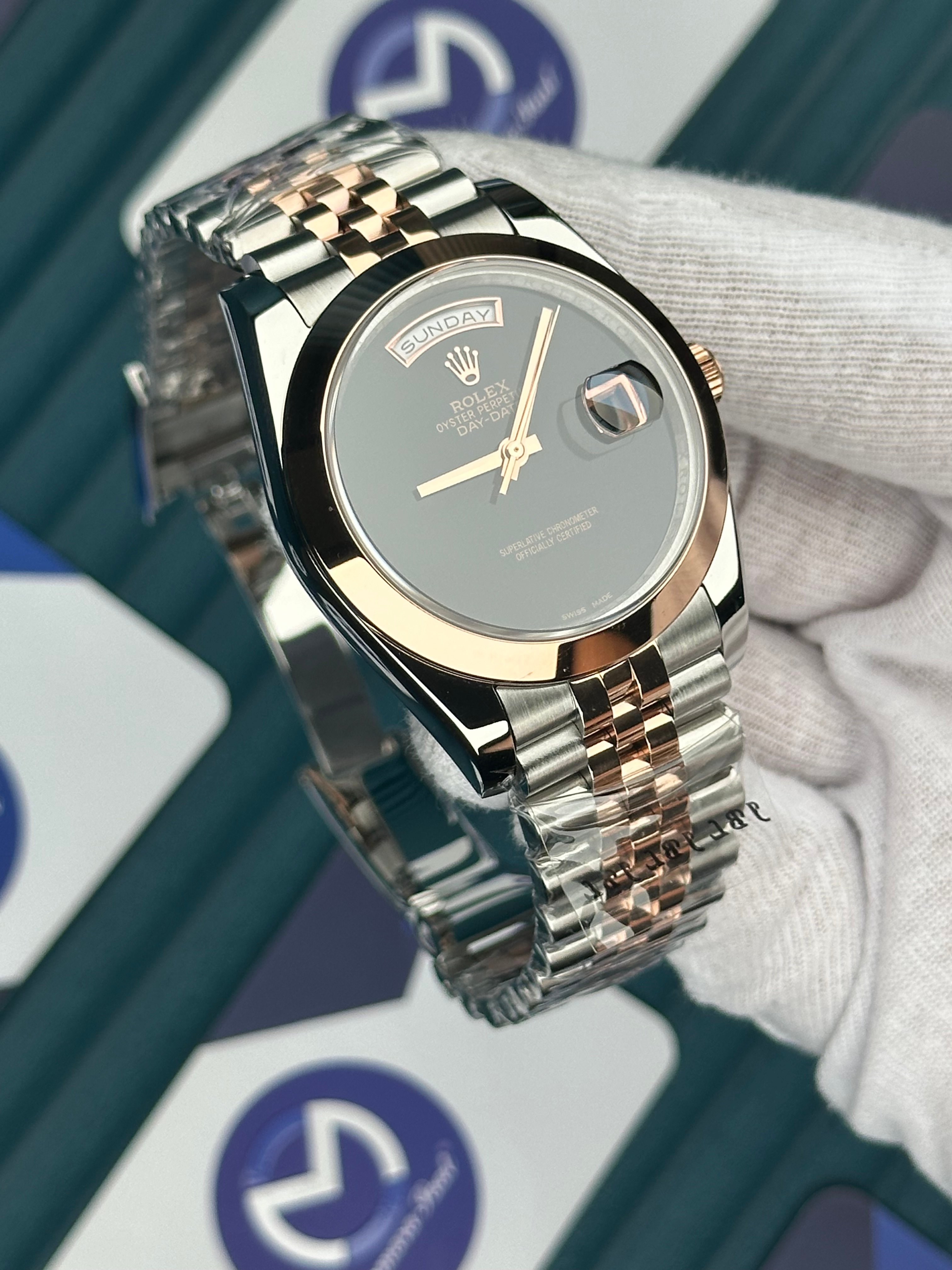 ROLEX DAY-DATE BLACK DIAL NO INDEX OVAL BEZEL ROSE-SILVER JUBILE