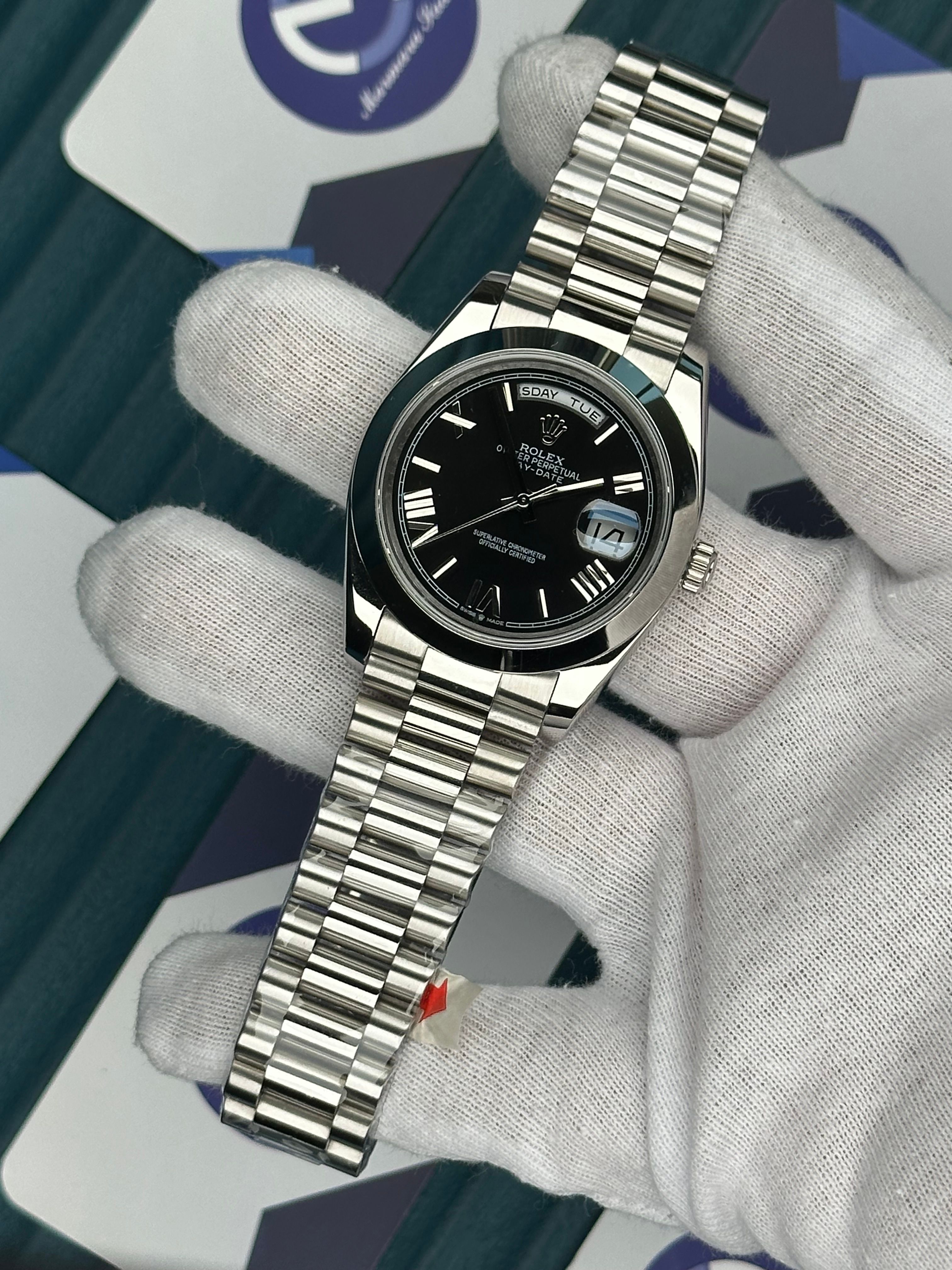 ROLEX DAY-DATE BLACK DIAL OVAL BEZEL ROMA INDEX SILVER PRESIDENT