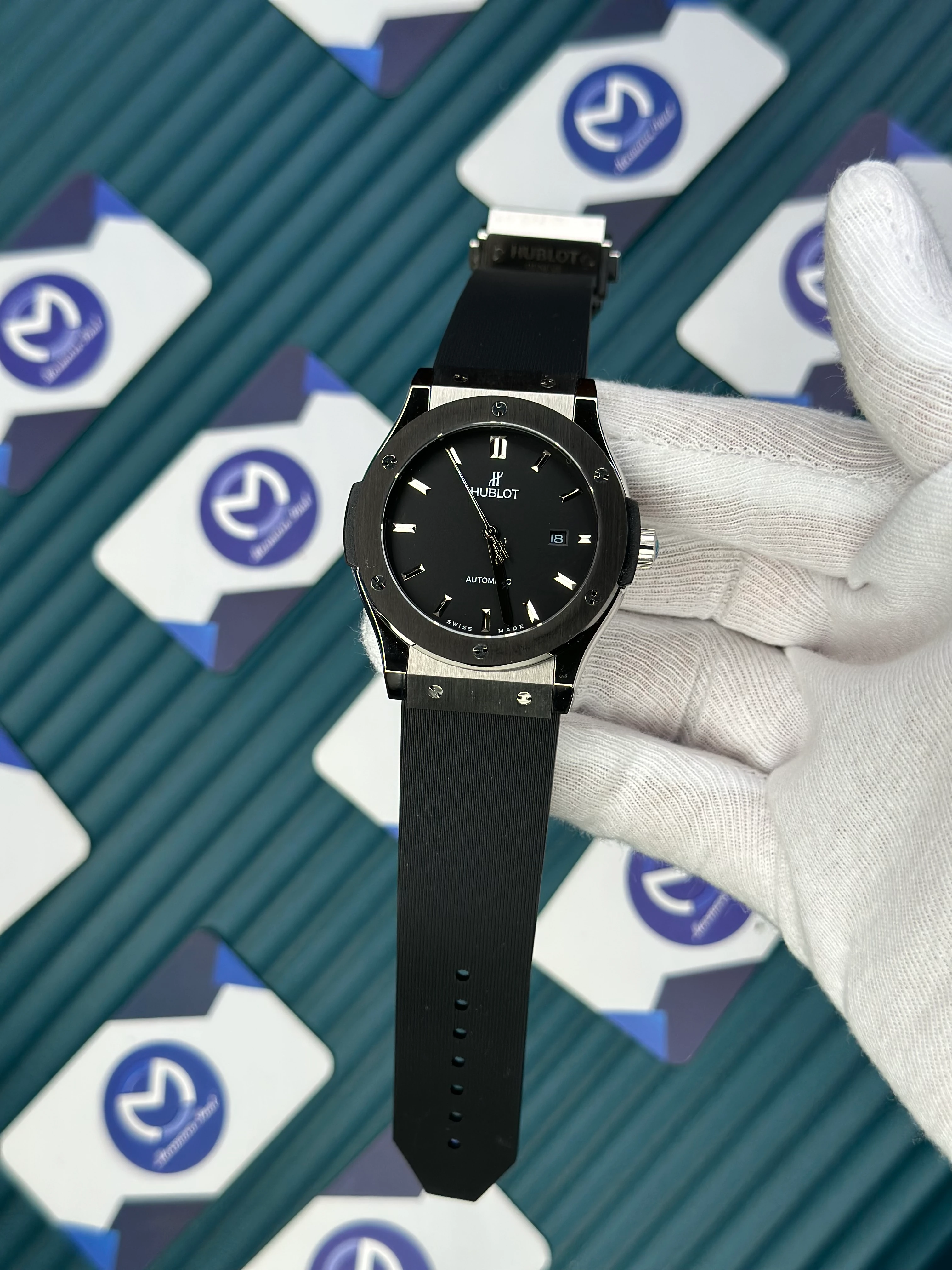 HUBLOT GENEVE AUTOMATIC VENDOME BLACK DIAL SILVER CASE BLACK BEZEL BLACK RUBBER CORD 