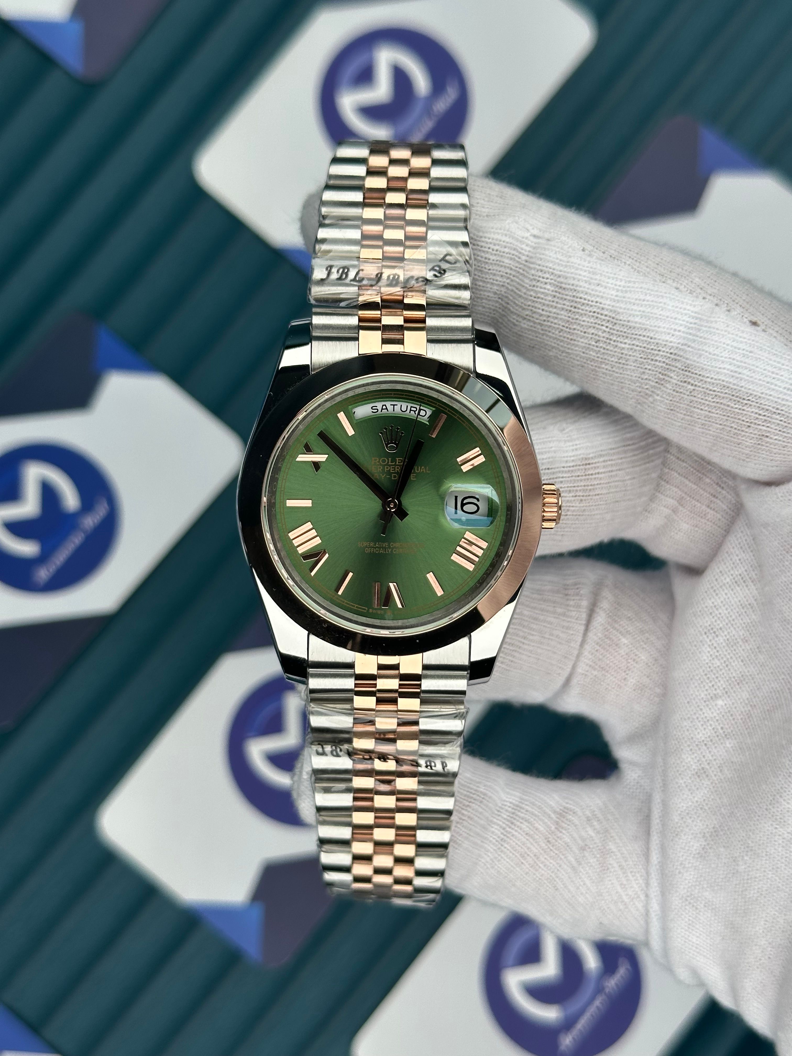 ROLEX DAY-DATE GREEN DIAL ROMA INDEX OVAL BEZEL ROSE-SILVER JUBILE