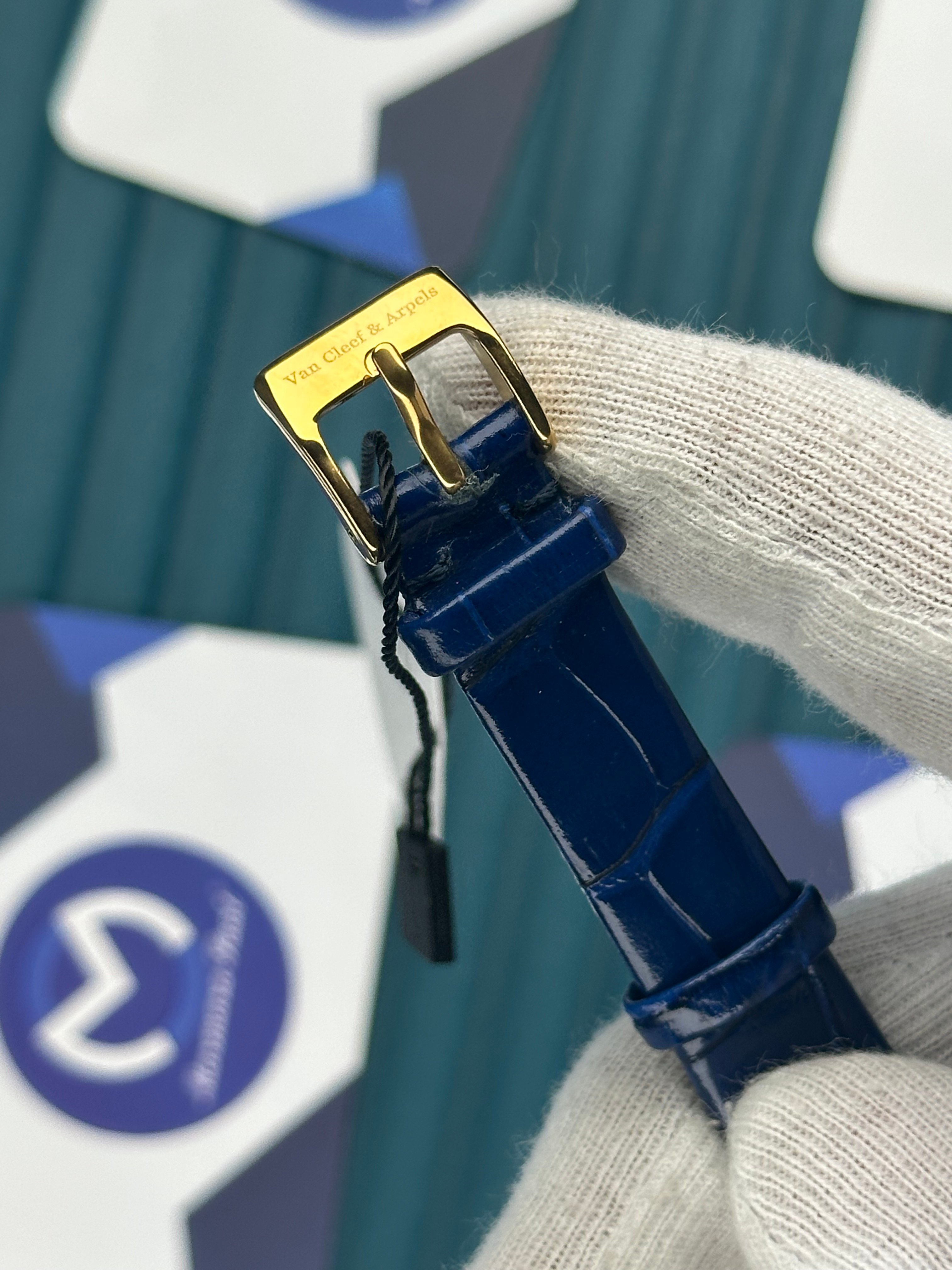 VAN CLEEF & ARPELS BLUE DIAL DIAMOND BEZEL GOLD CASE BLUE LEATHER CORD