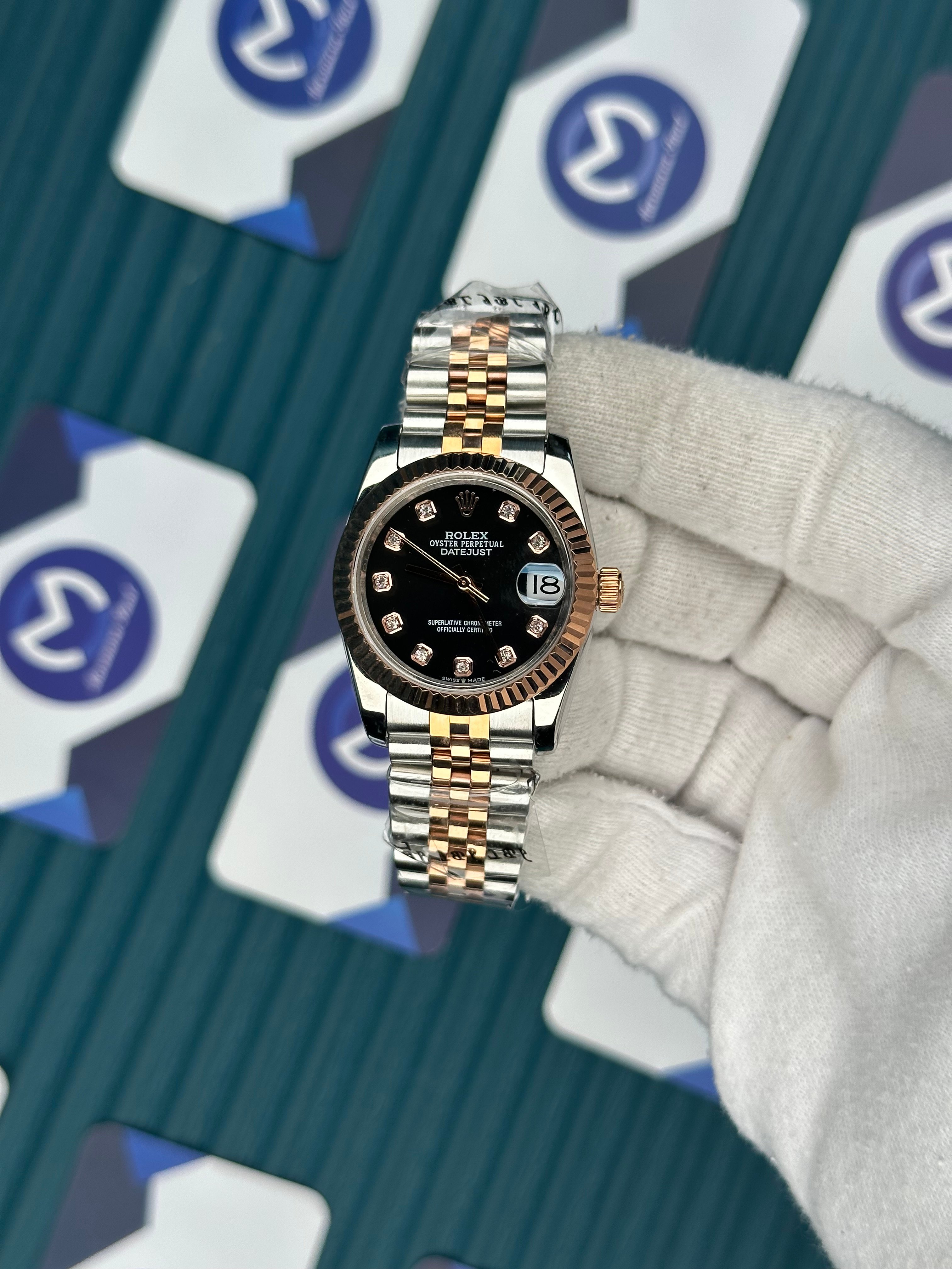 ROLEX 31 BLACK DIAL ROSE-SILVER JUBILEE