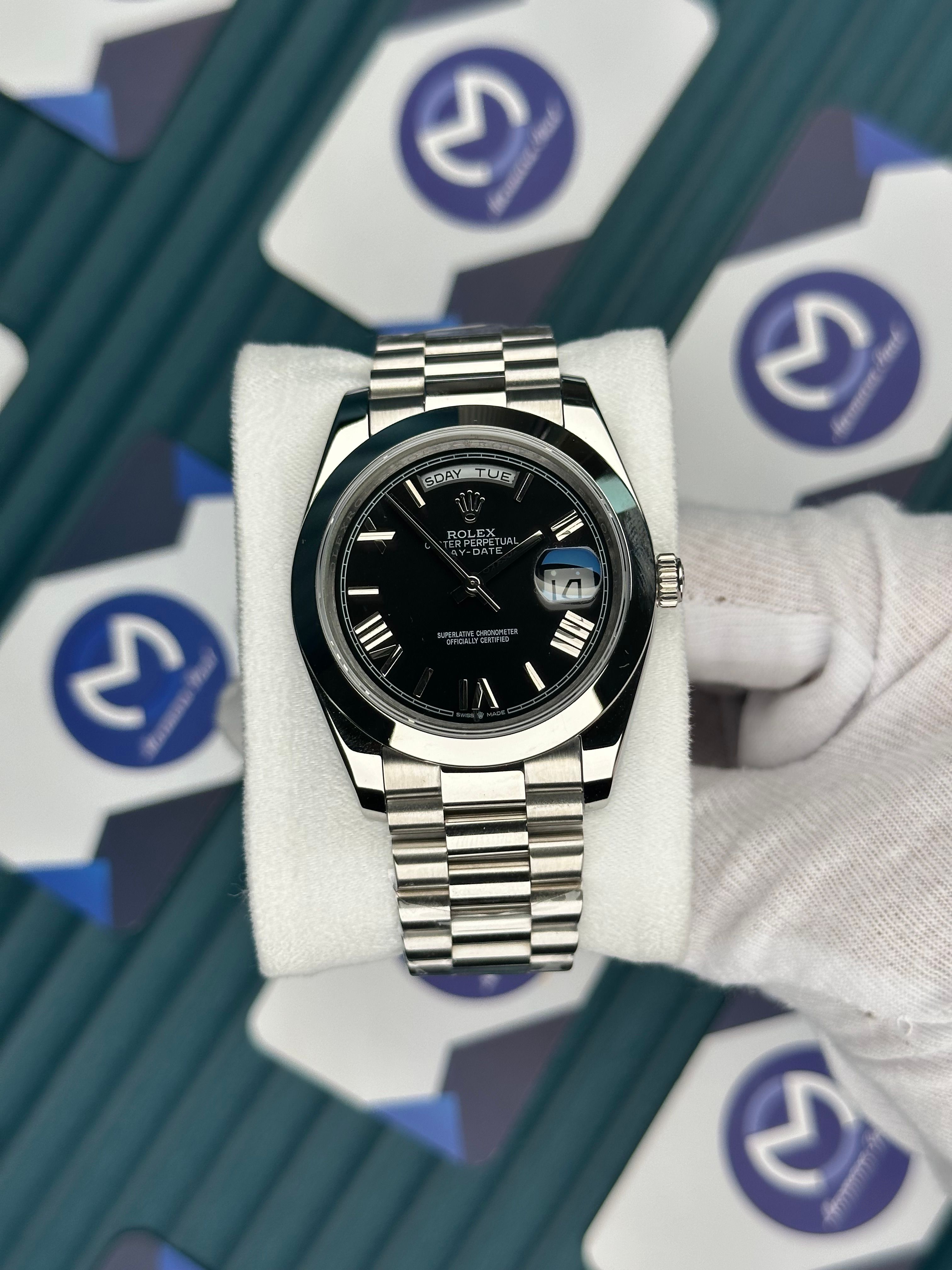 ROLEX DAY-DATE BLACK DIAL OVAL BEZEL ROMA INDEX SILVER PRESIDENT