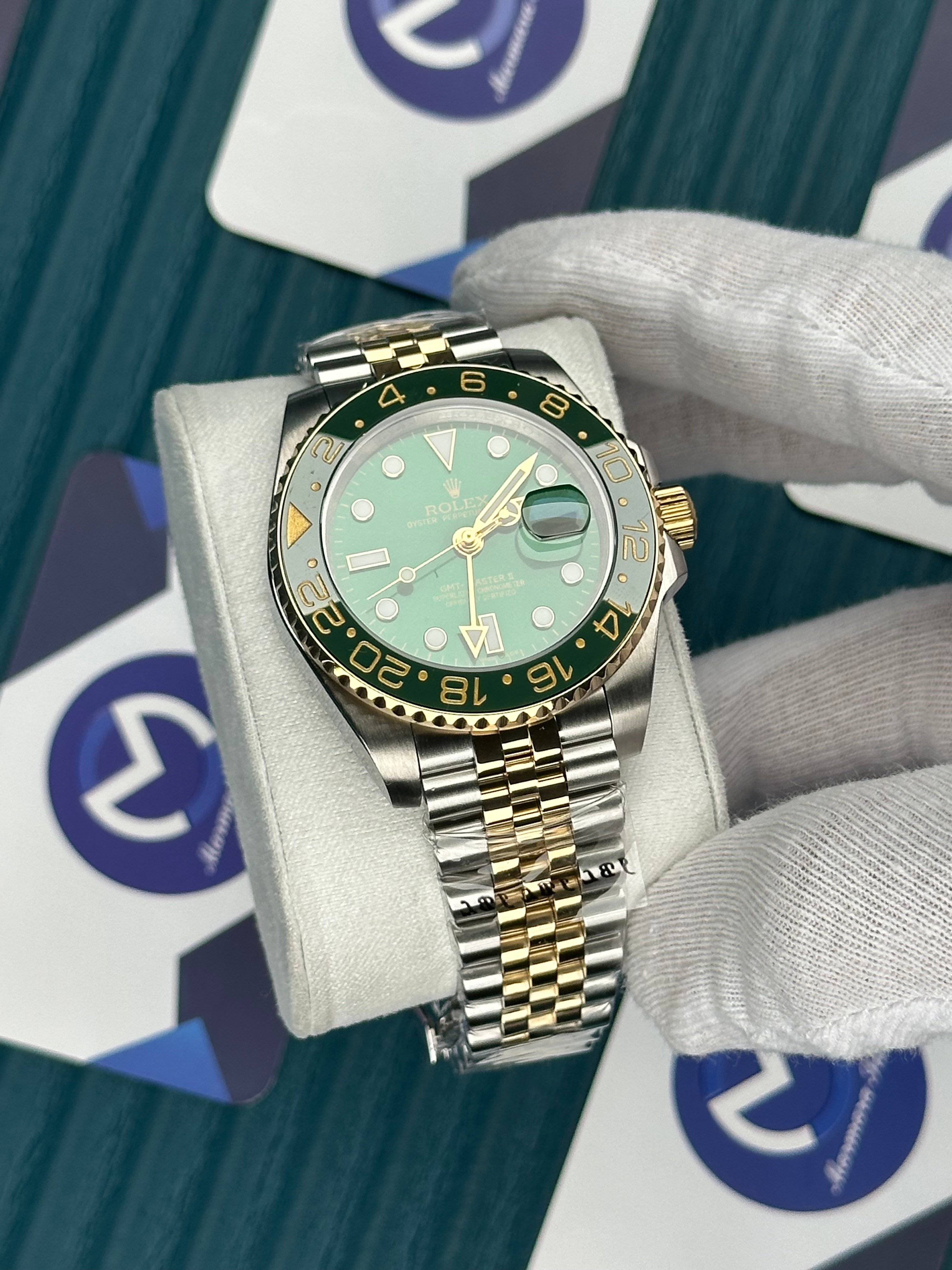 ROLEX GMT MASTER II GREEN DIAL AND BEZEL GOLD-SILVER JUBILE