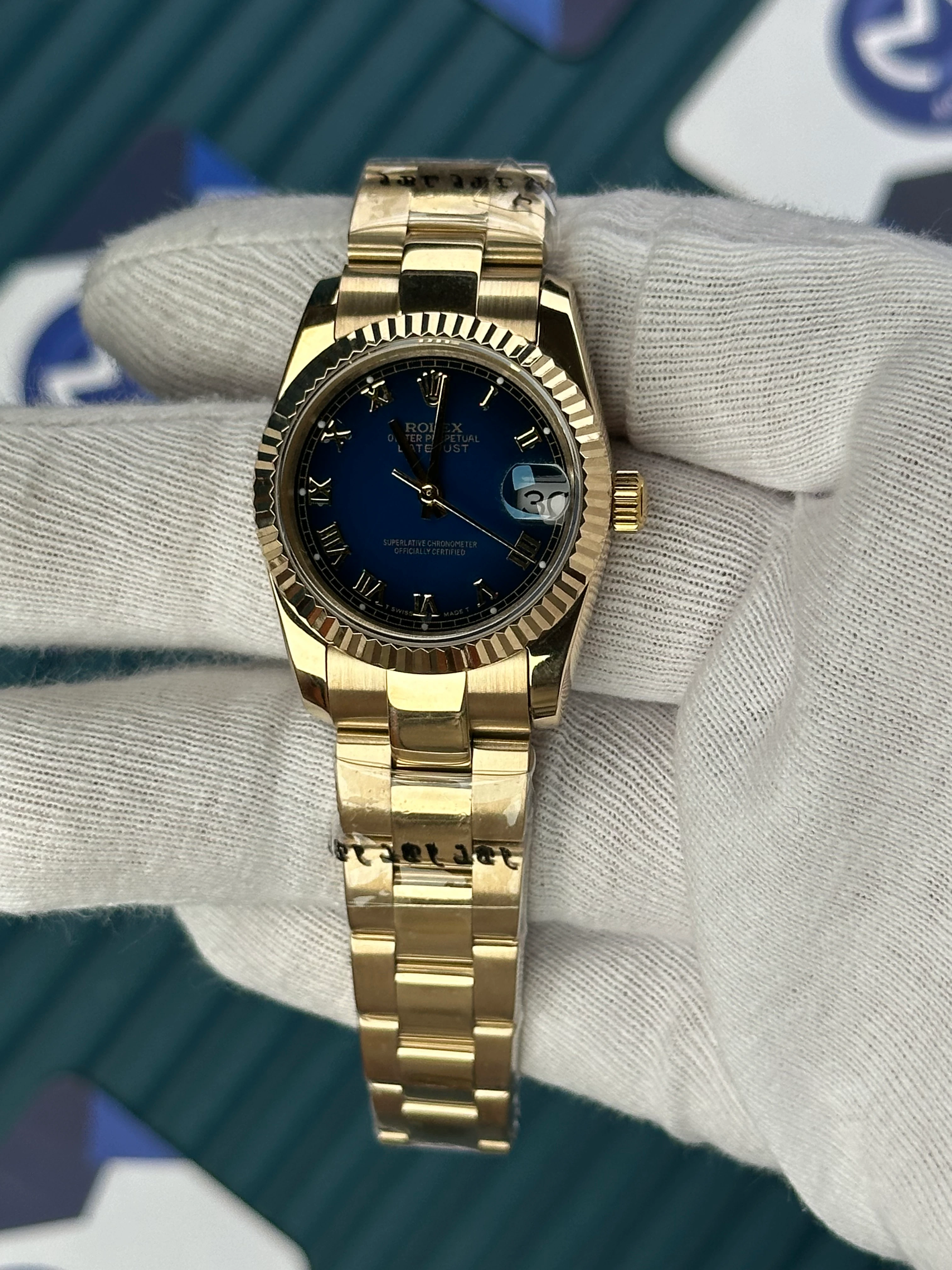 ROLEX 31 MM DATEJUST BLUE DIAL ROMA INDEX GOLD OYSTER 