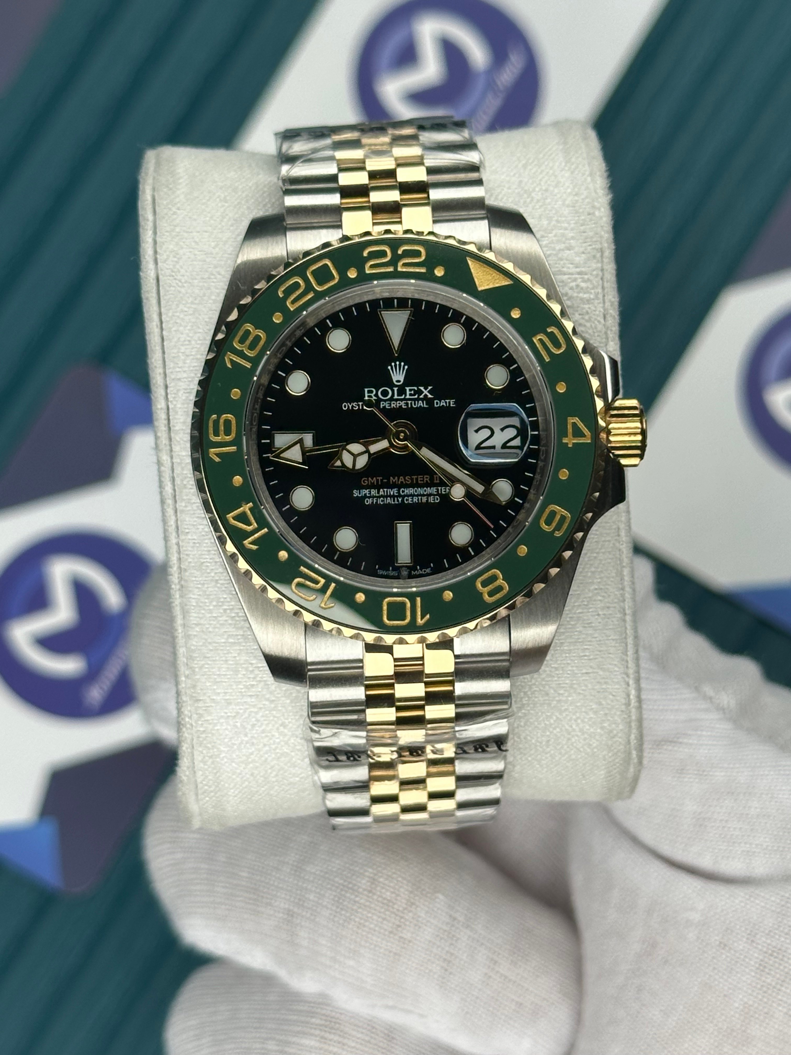 ROLEX GMT MASTER II BLACK DIAL GREEN BEZEL GOLD-SILVER JUBILE