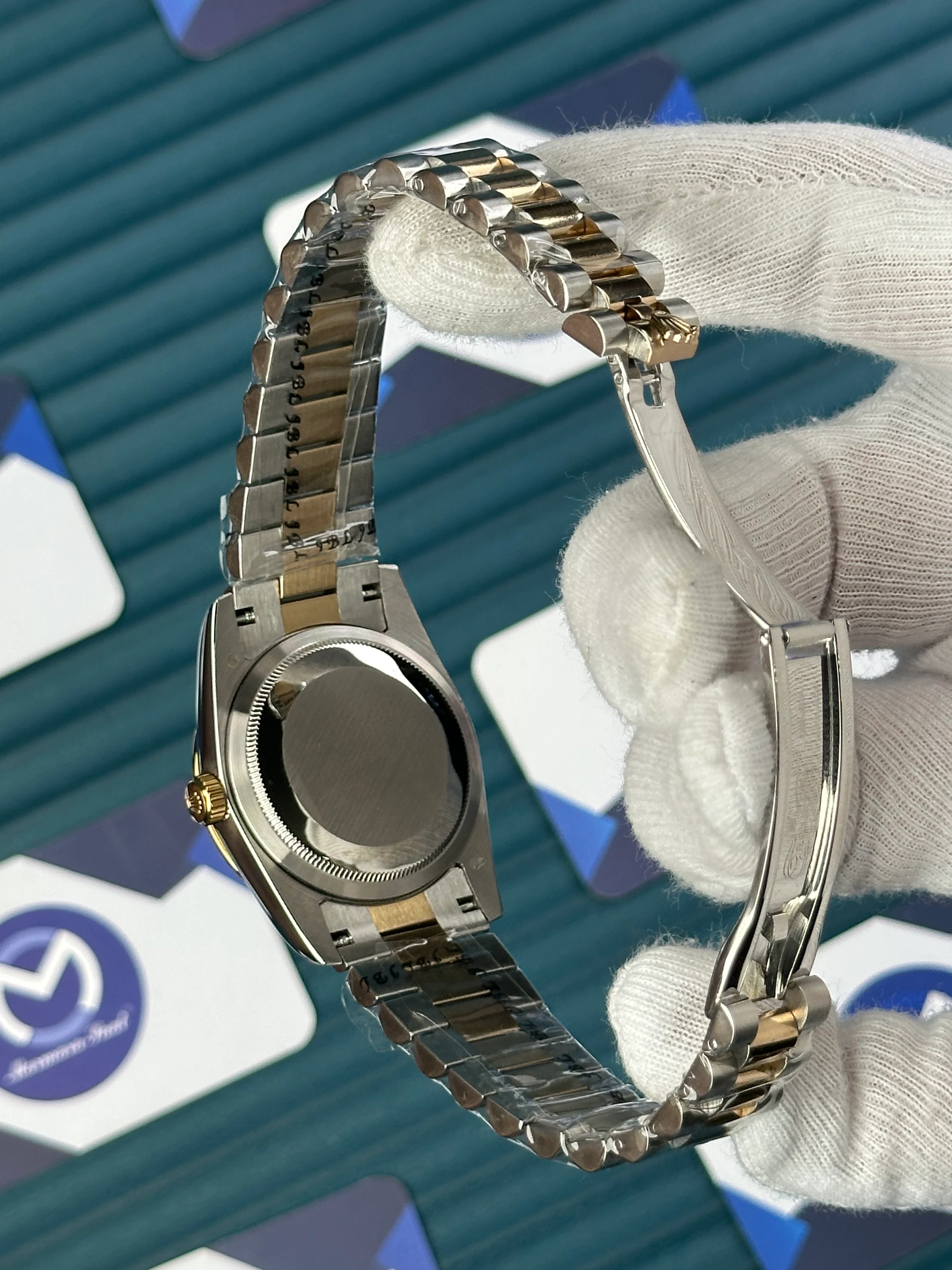 ROLEX 36 MM DAY-DATE BLACK PATTERNED DIAL DIAMOND INDEX AND BEZEL GOLD-SILVER PREIDENT 