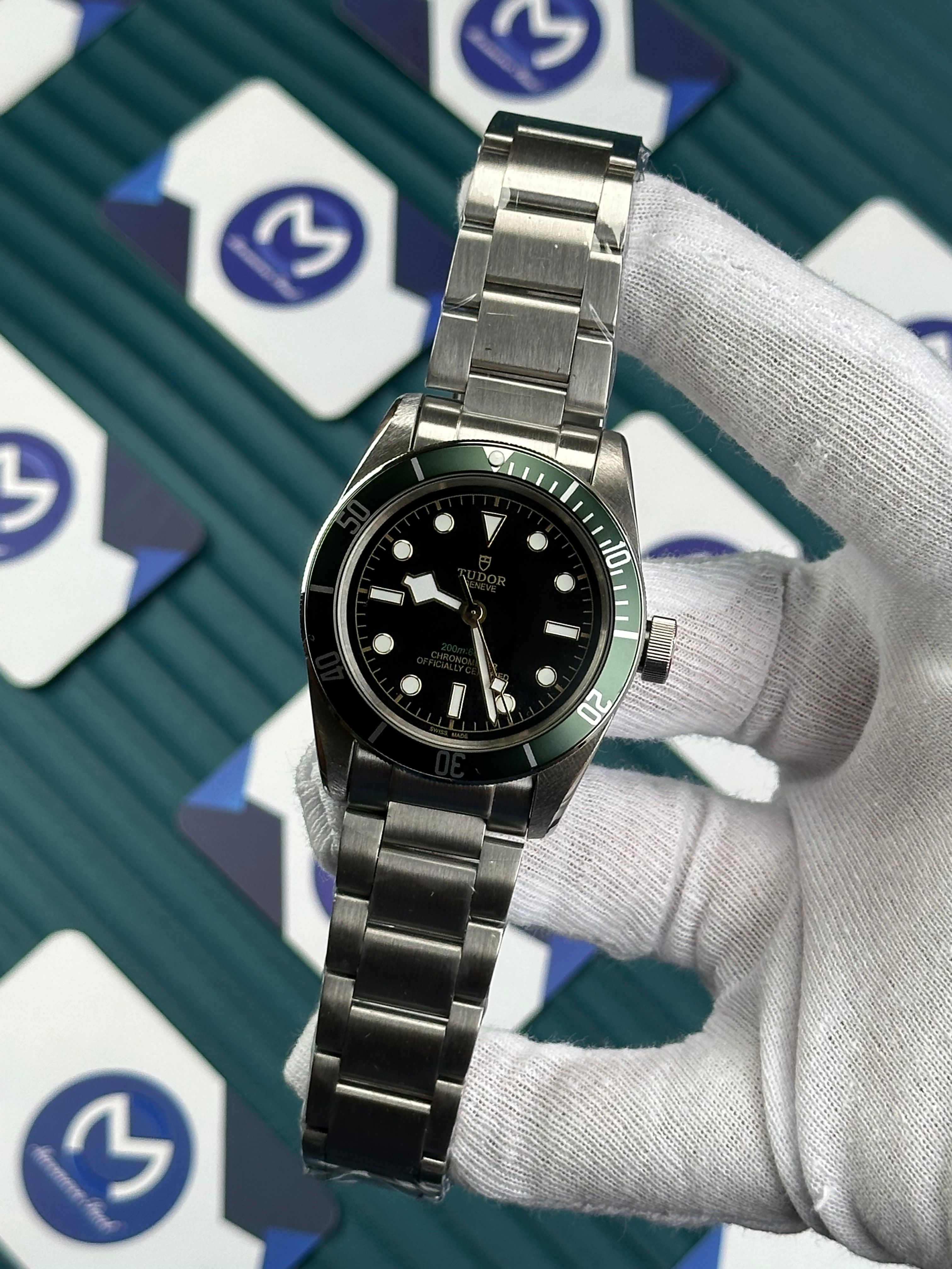 TUDOR BLACK DIAL GREEN BEZEL SILVER