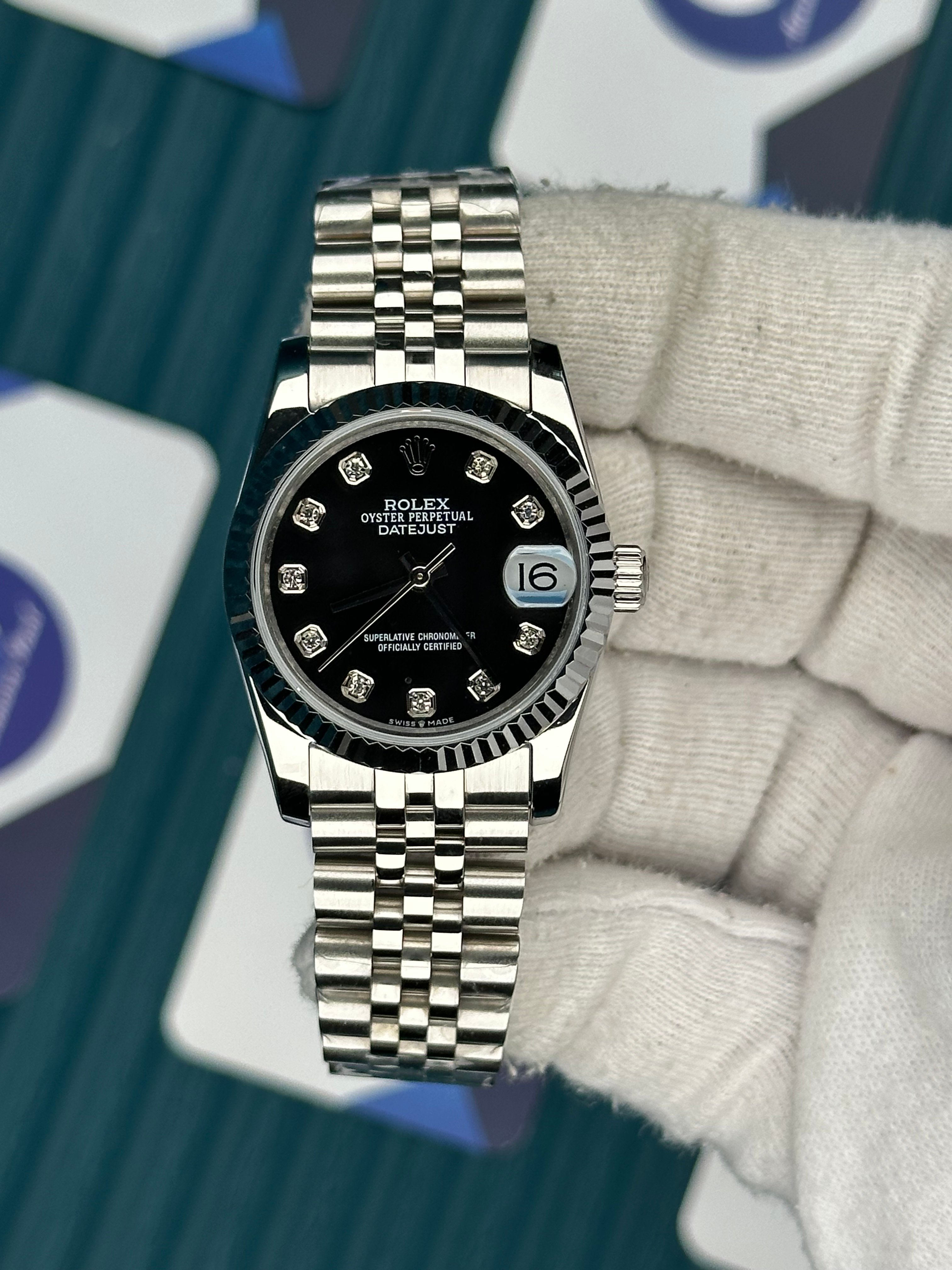 ROLEX 31 BLACK DIAL DIAMOND INDEX SILVER JUBILEE