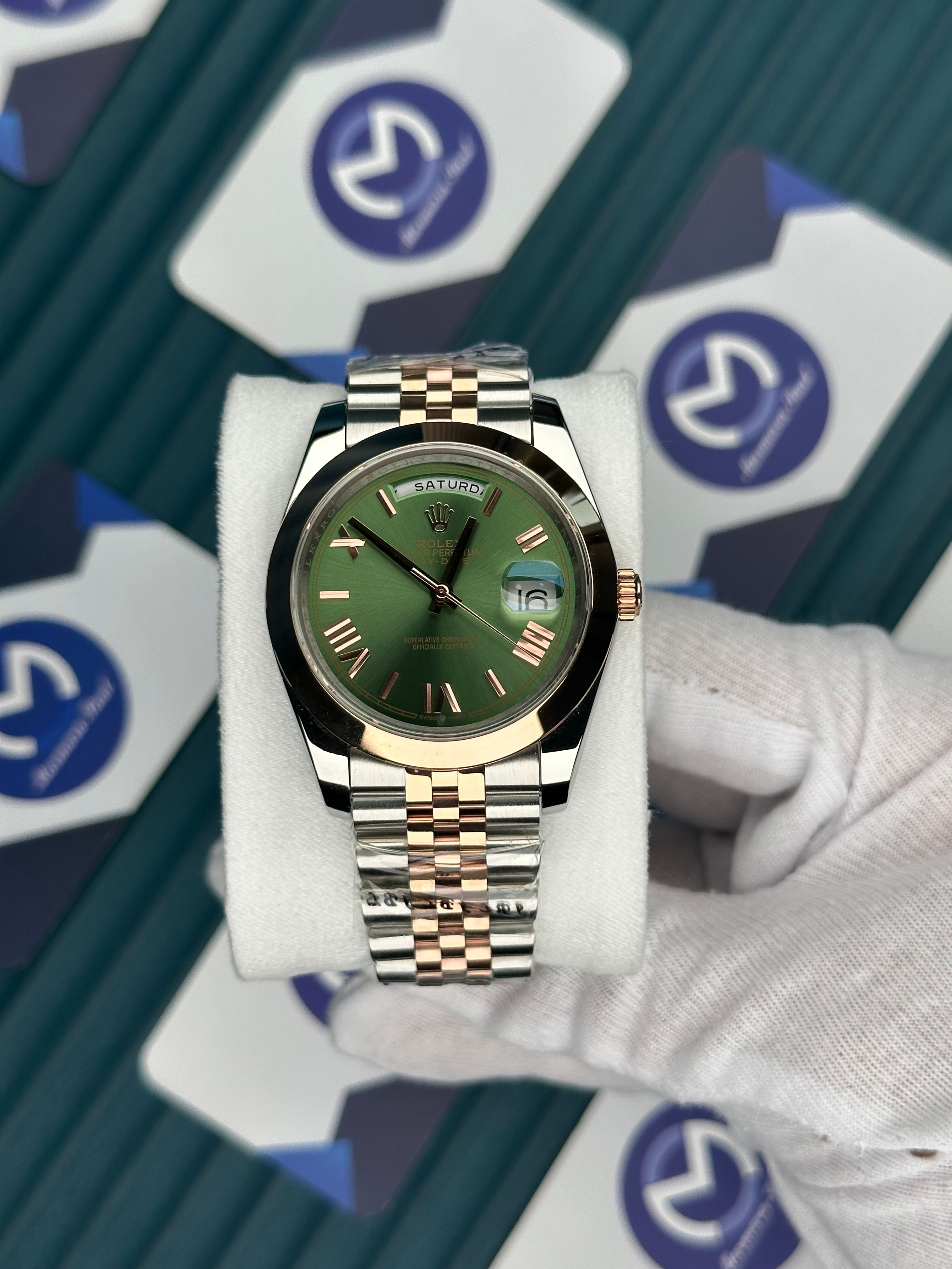ROLEX DAY-DATE GREEN DIAL ROMA INDEX OVAL BEZEL ROSE-SILVER JUBILE