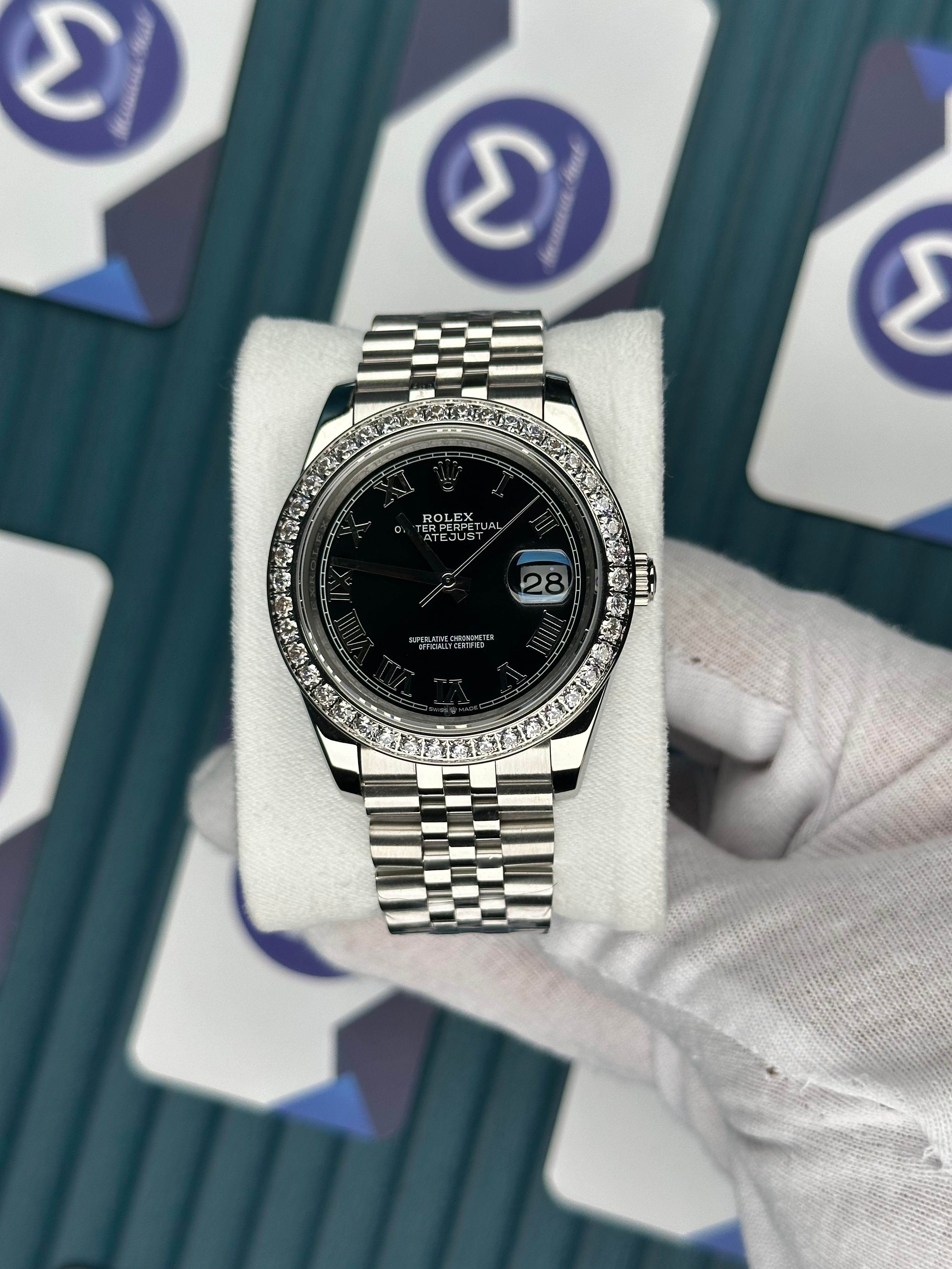 ROLEX DATEJUST BLACK DIAL DIAMOND BEZELROMA INDEX SILVER JUBILE