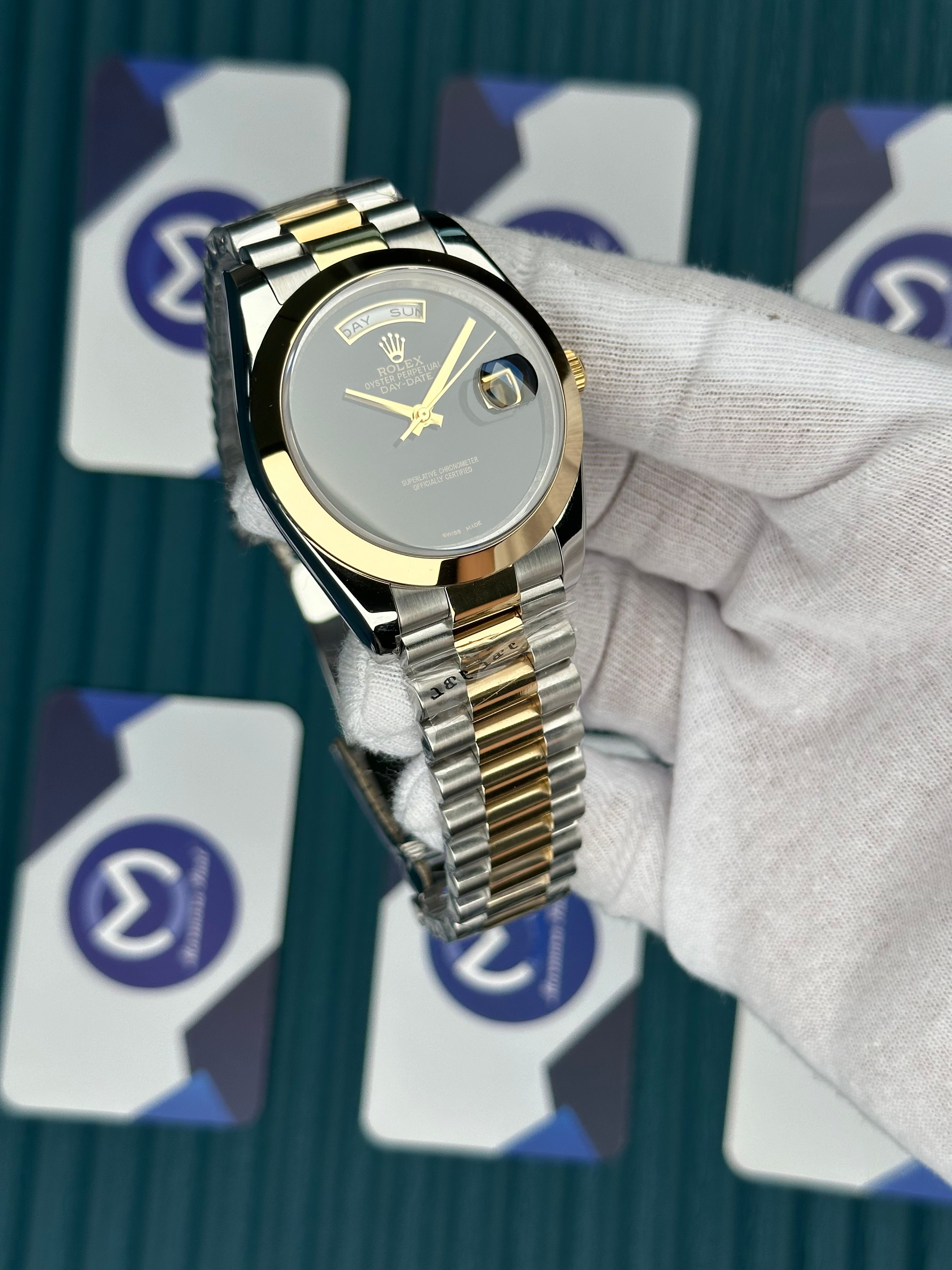 ROLEX DAY-DATE BLACK DIAL OVAL BEZEL GOLD-SILVER PRESIDENT
