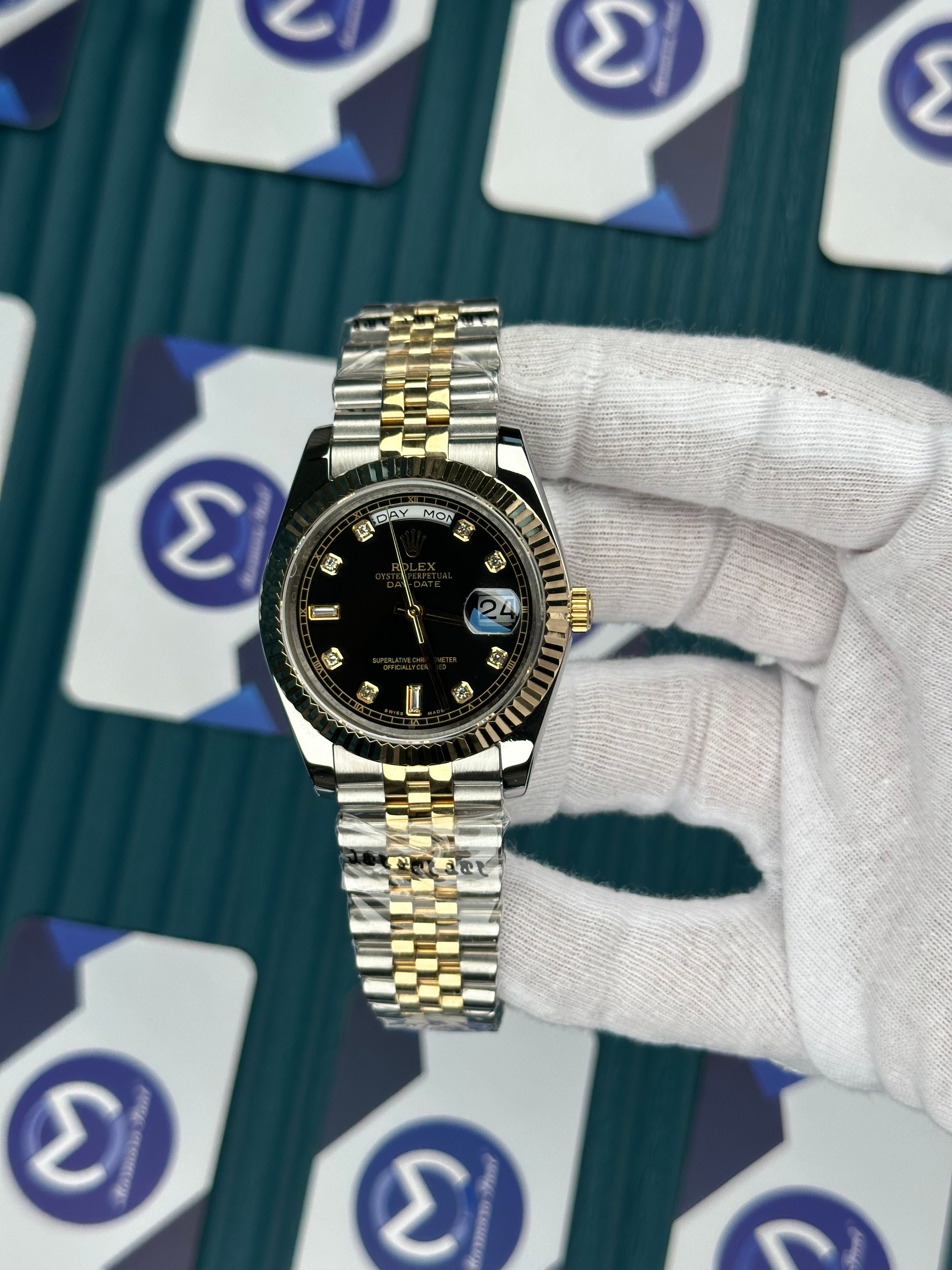 ROLEX DAY-DATE BLACK DIAL DIAMOND INDEX GOLD-SILVER JUBILE