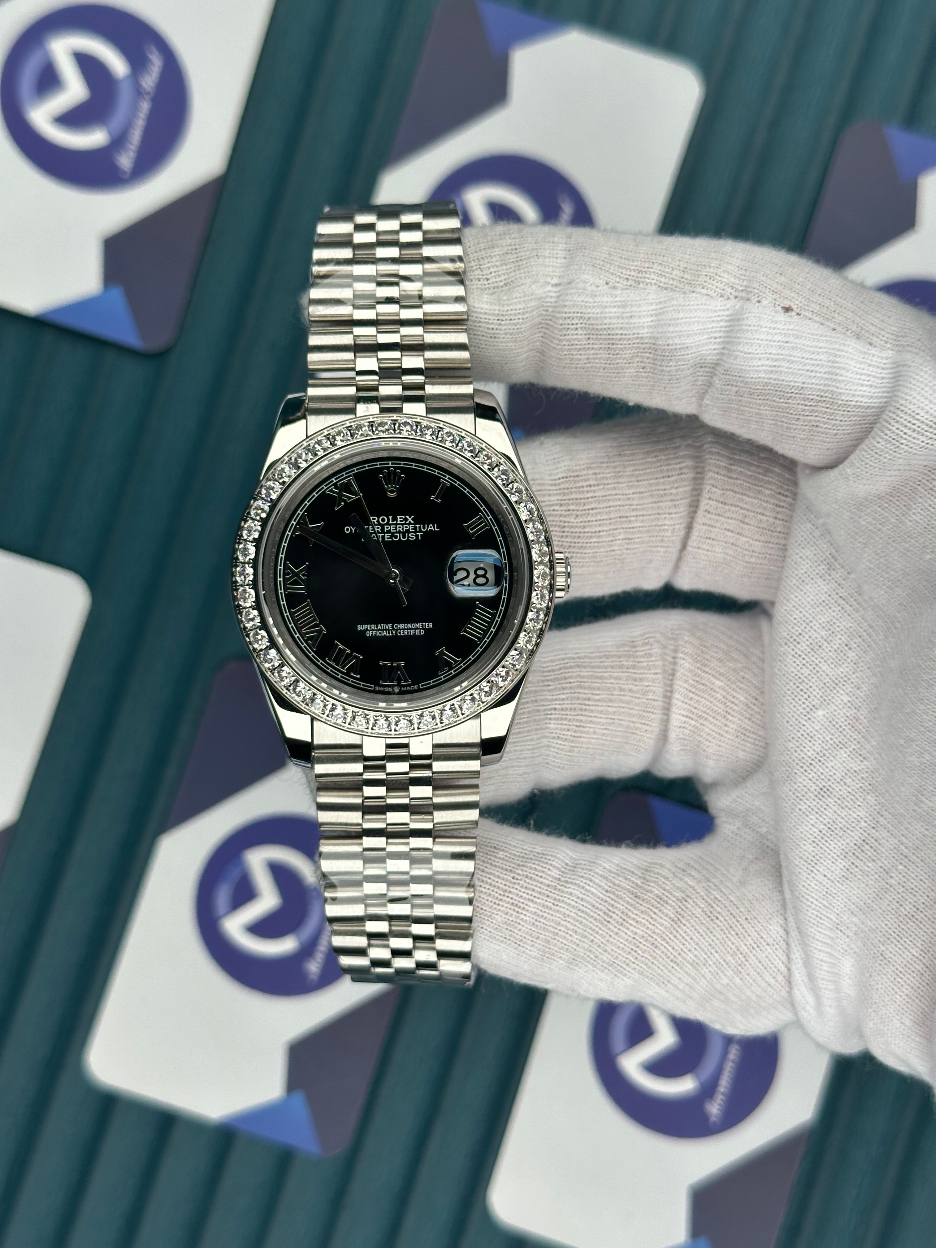 ROLEX DATEJUST BLACK DIAL DIAMOND BEZELROMA INDEX SILVER JUBILE
