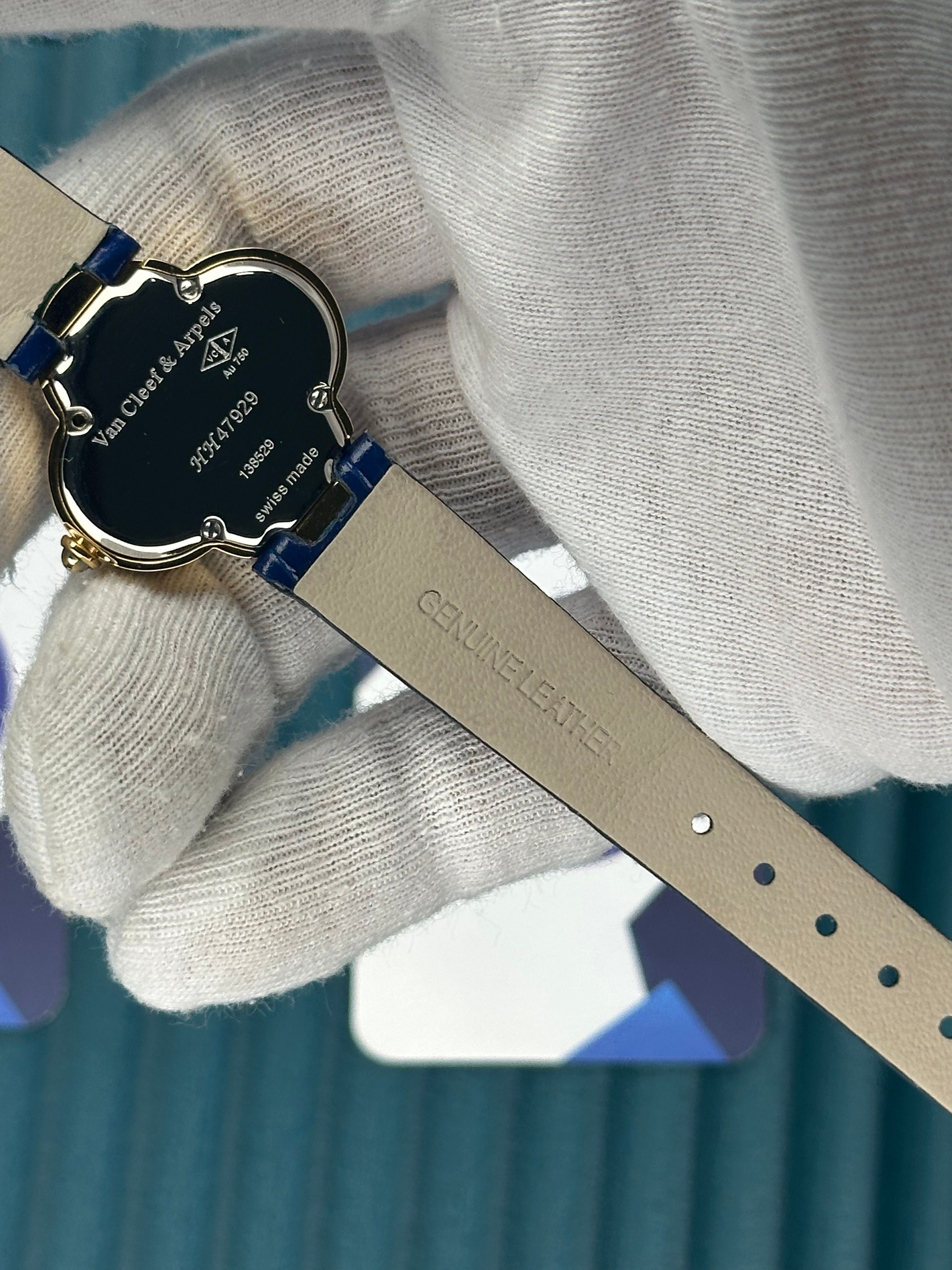 VAN CLEEF & ARPELS BLUE DIAL DIAMOND BEZEL GOLD CASE BLUE LEATHER CORD