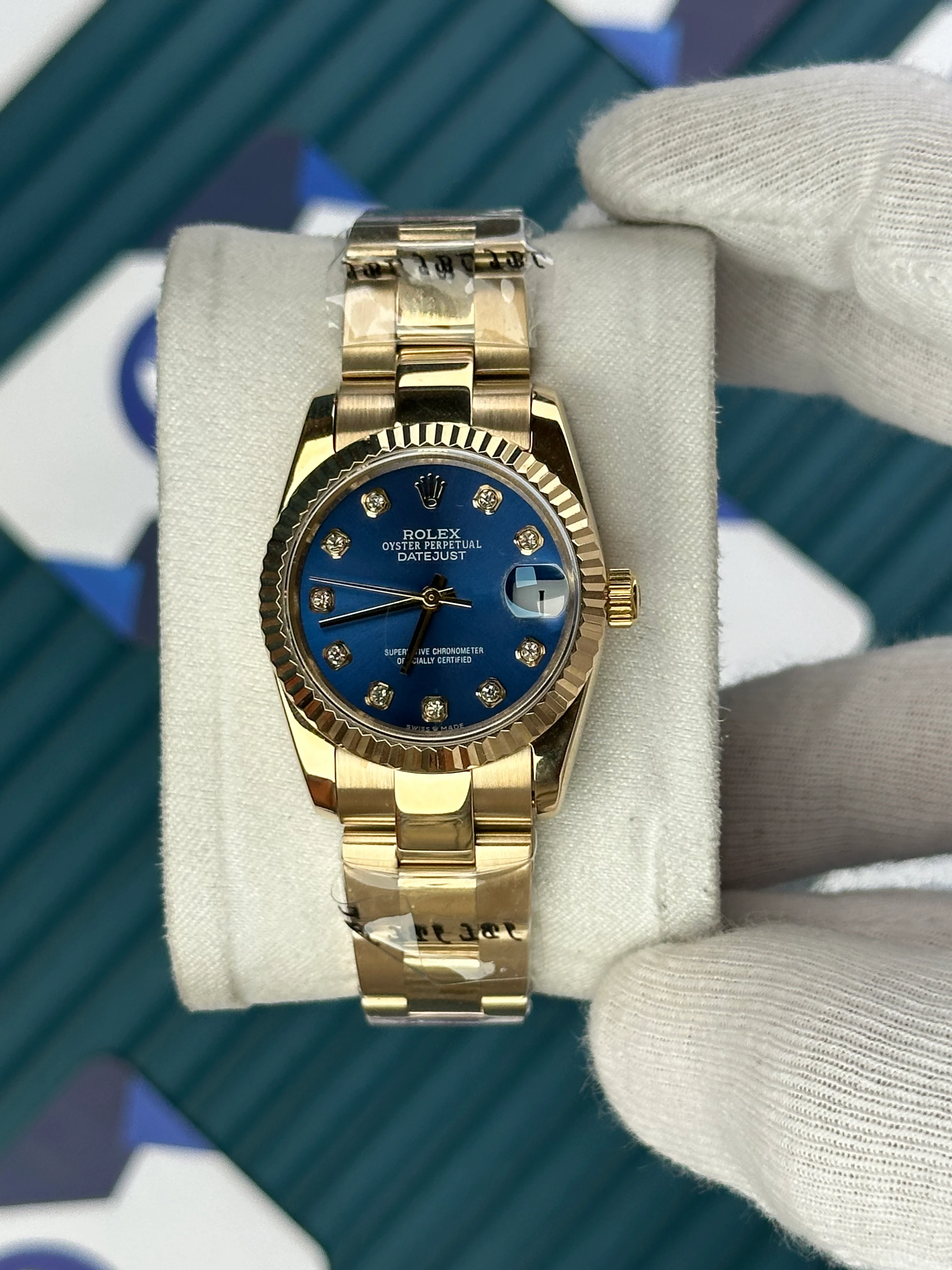 ROLEX 31 MM DATEJUST BLUE DIAL DIAMOND INDEX GOLD OYSTER 