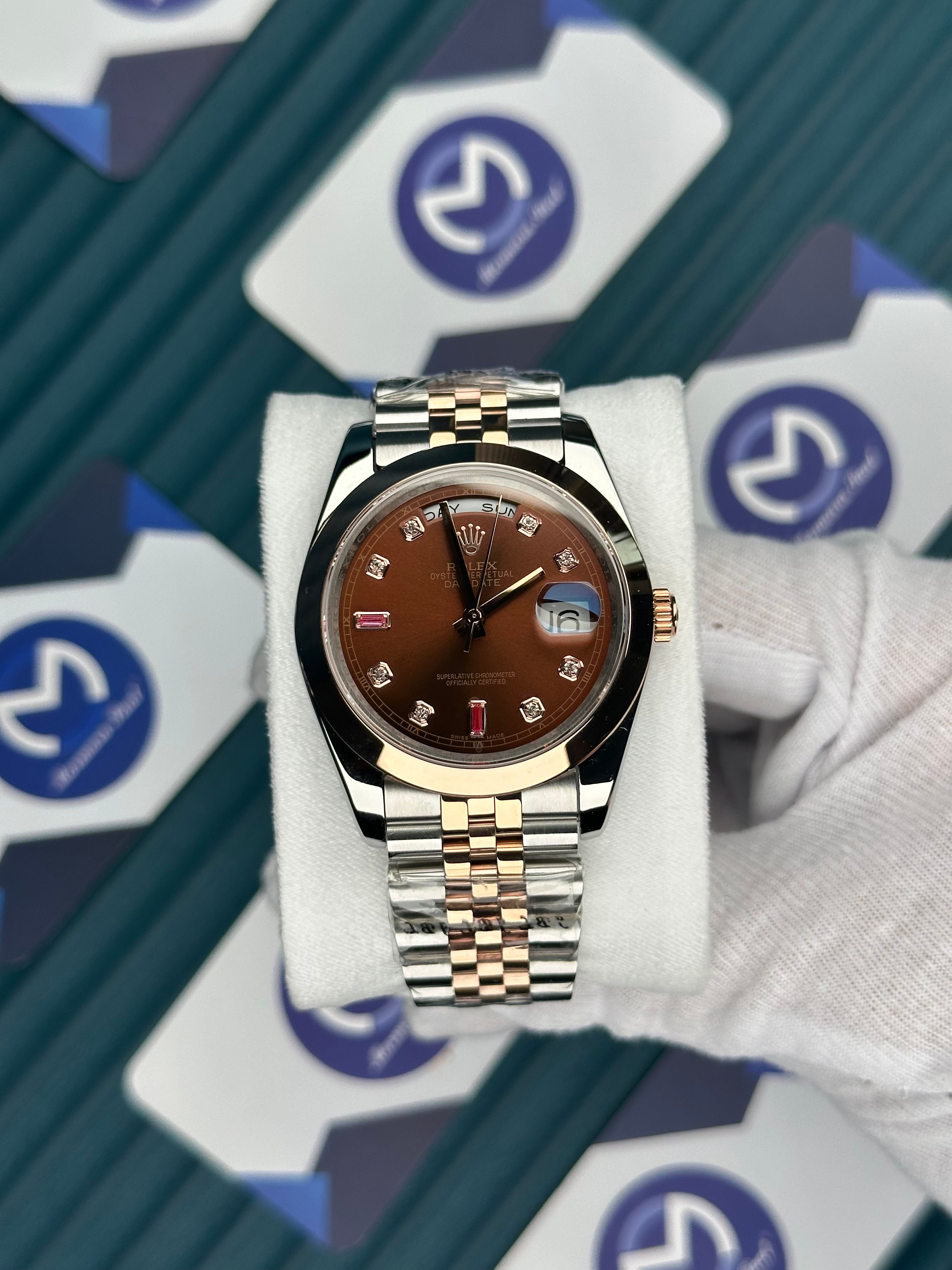 ROLEX DAY-DATE CHOCOLATE DIAL DIAMOND INDEX OVAL BEZEL ROSE-SILVER JUBILE