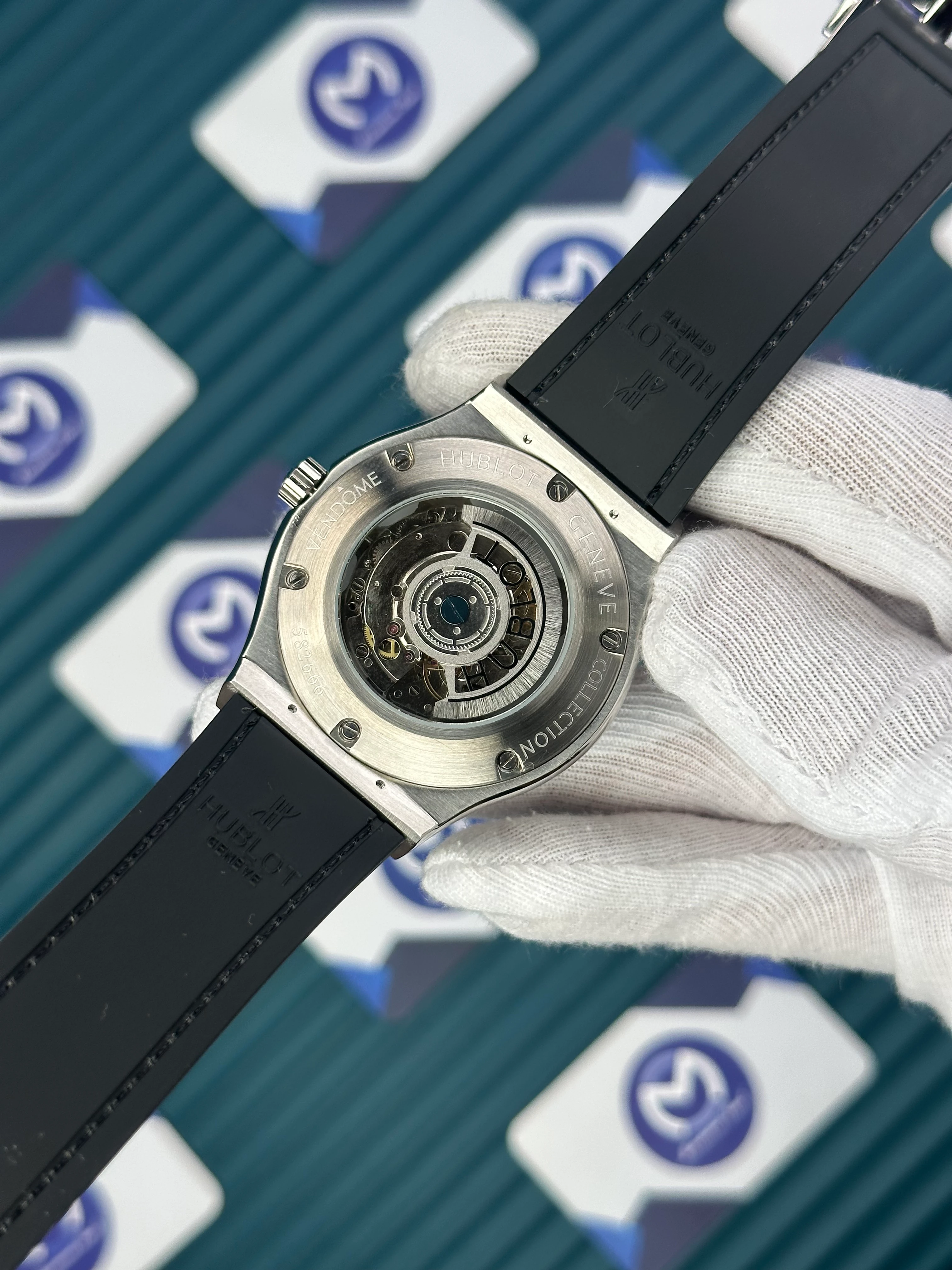 HUBLOT GENEVE AUTOMATIC BLACK DIAL SILVER CASE BLACK BEZEL BLACK LEATHER CORD 