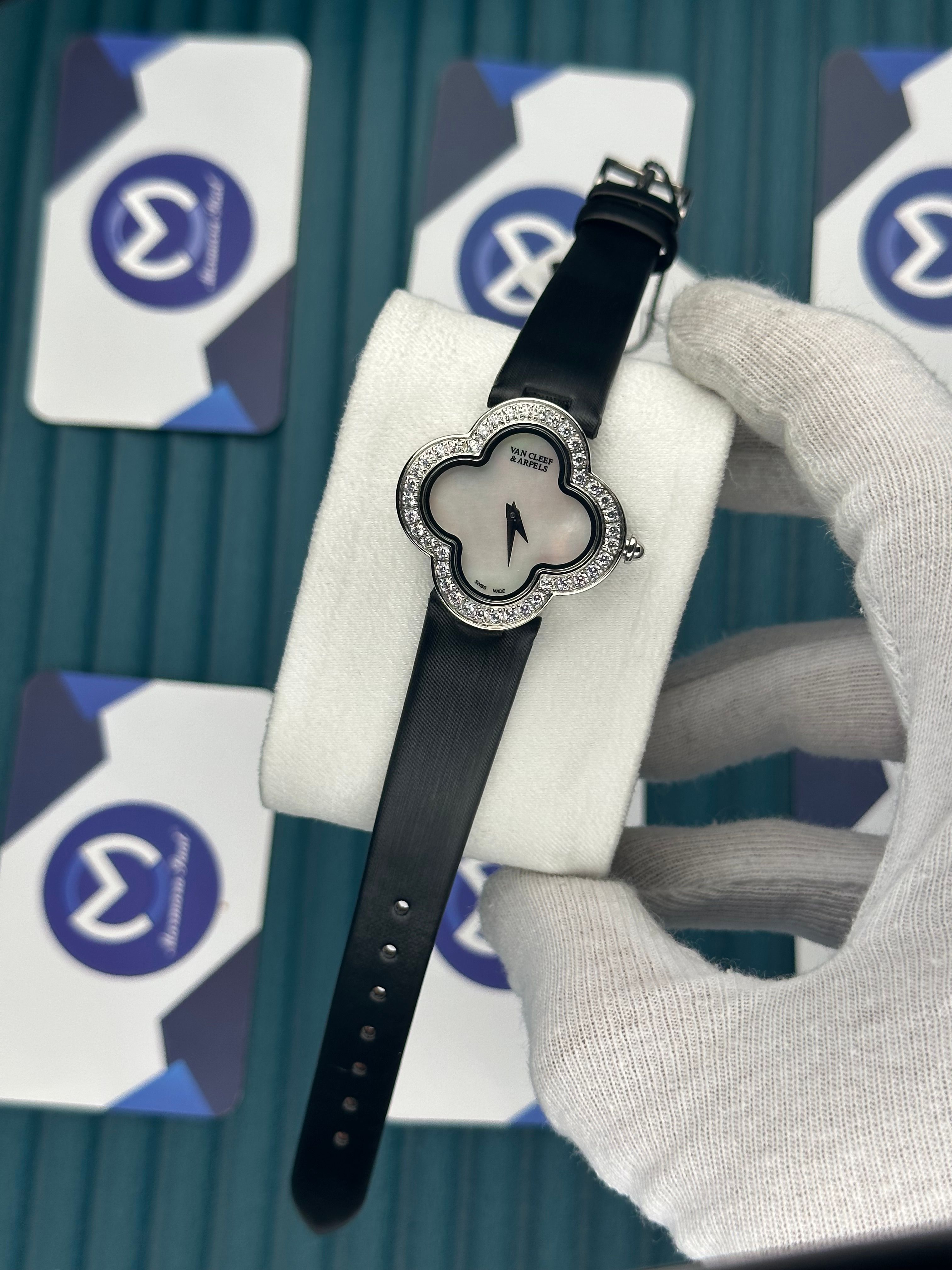 VAN CLEEF & ARPELS WHITE DIAL DIAMOND BEZEL SILVER CASE BLACK LEATHER CORD