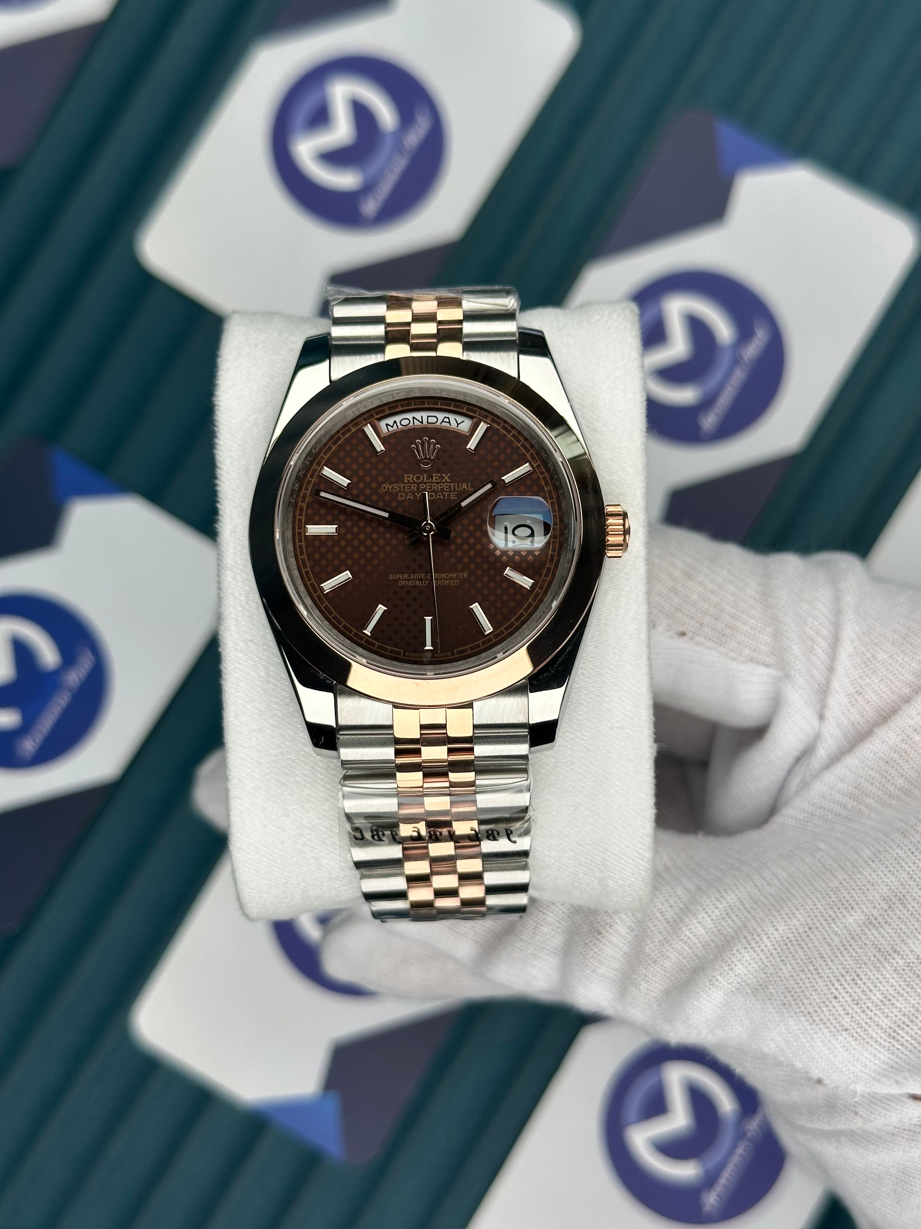 ROLEX DAY-DATE MOZAIK CHOCOLATE OVAL BEZEL ROSE-SILVER JUBILE