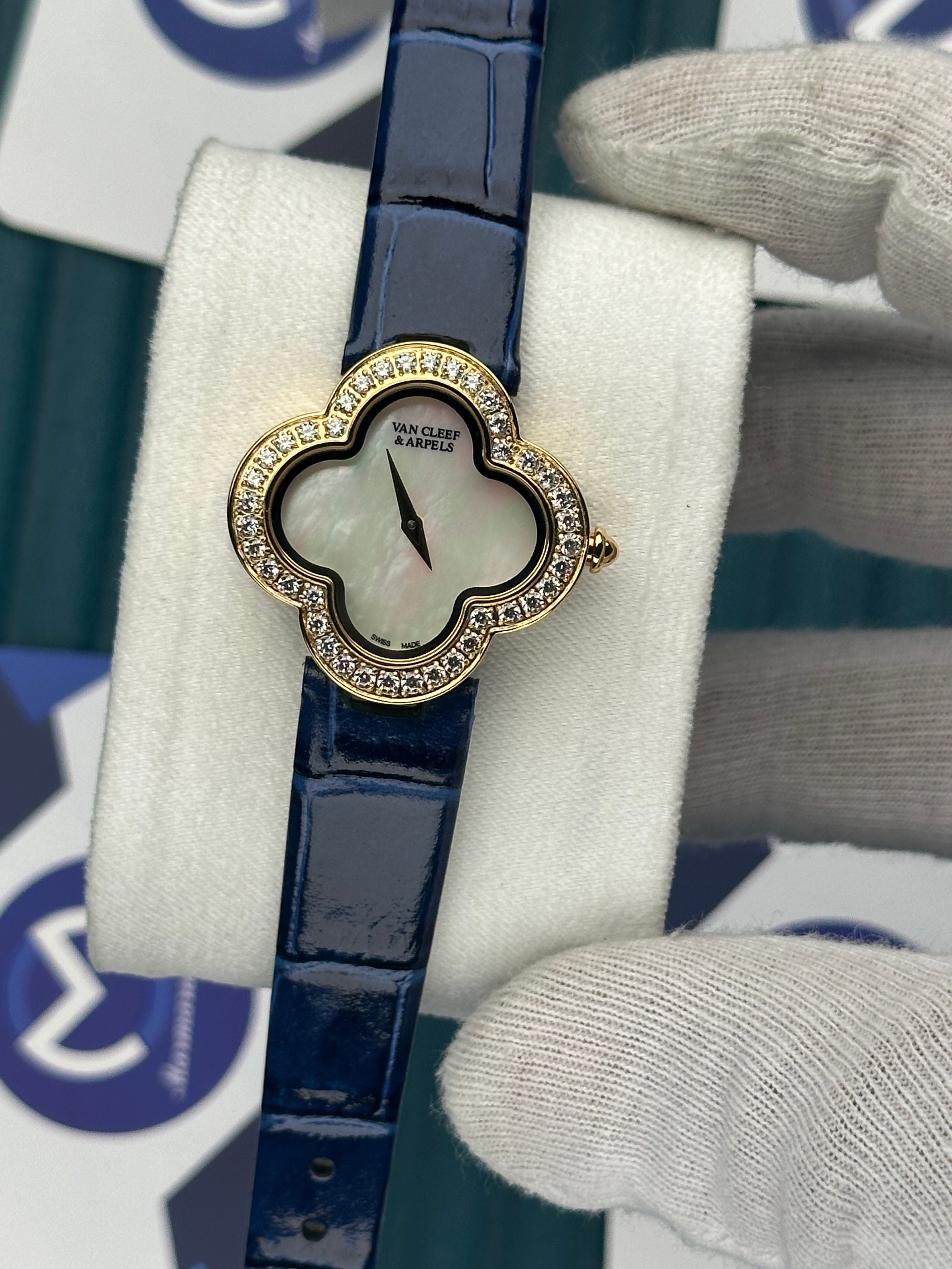VAN CLEEF & ARPELS WHITE DIAL DIAMOND BEZEL GOLD CASE BLUE LEATHER CORD