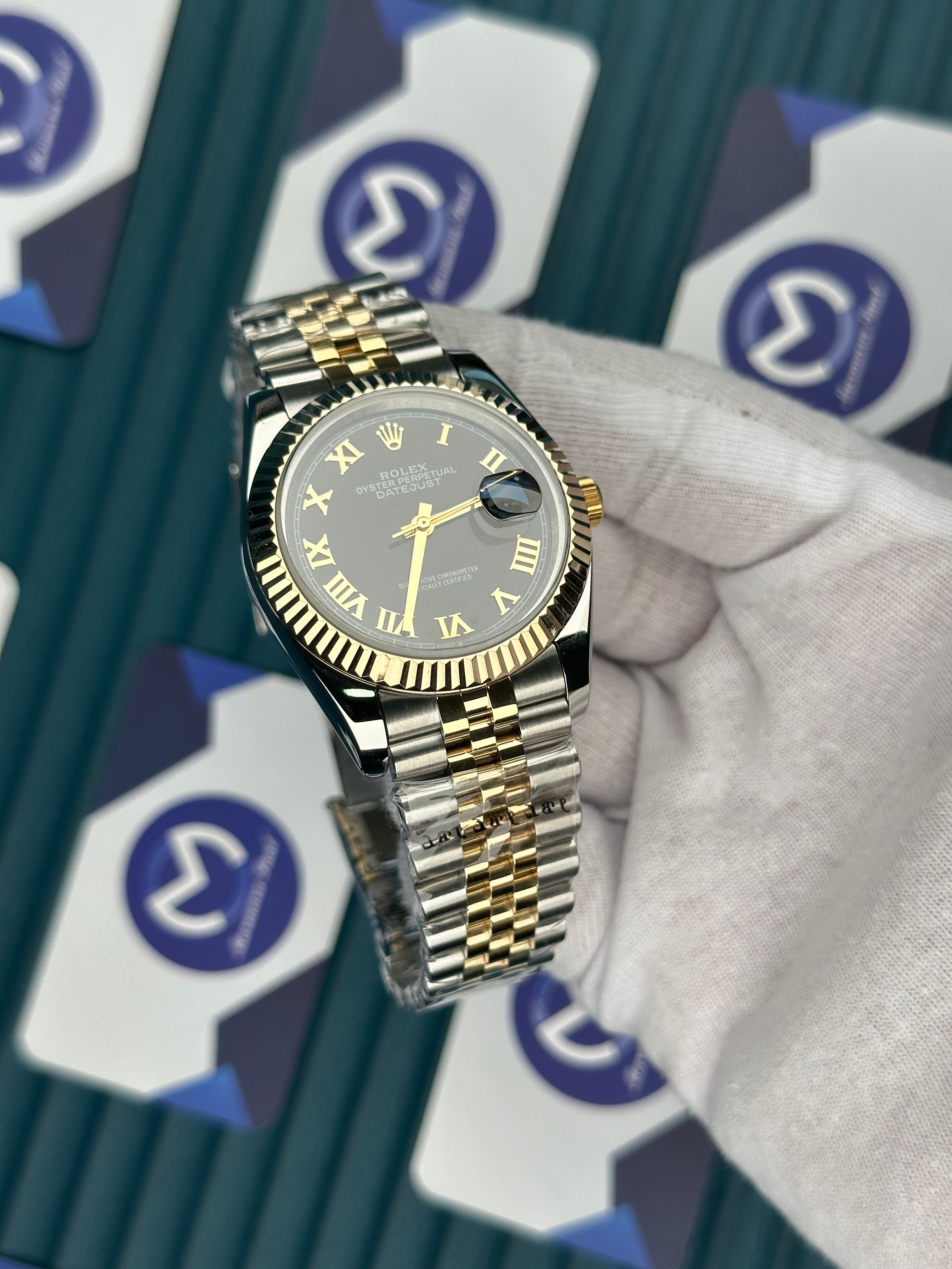 ROLEX DATEJUST GOLD ROMA INDEX BLACK DIAL GOLD-SILVER JUBILE
