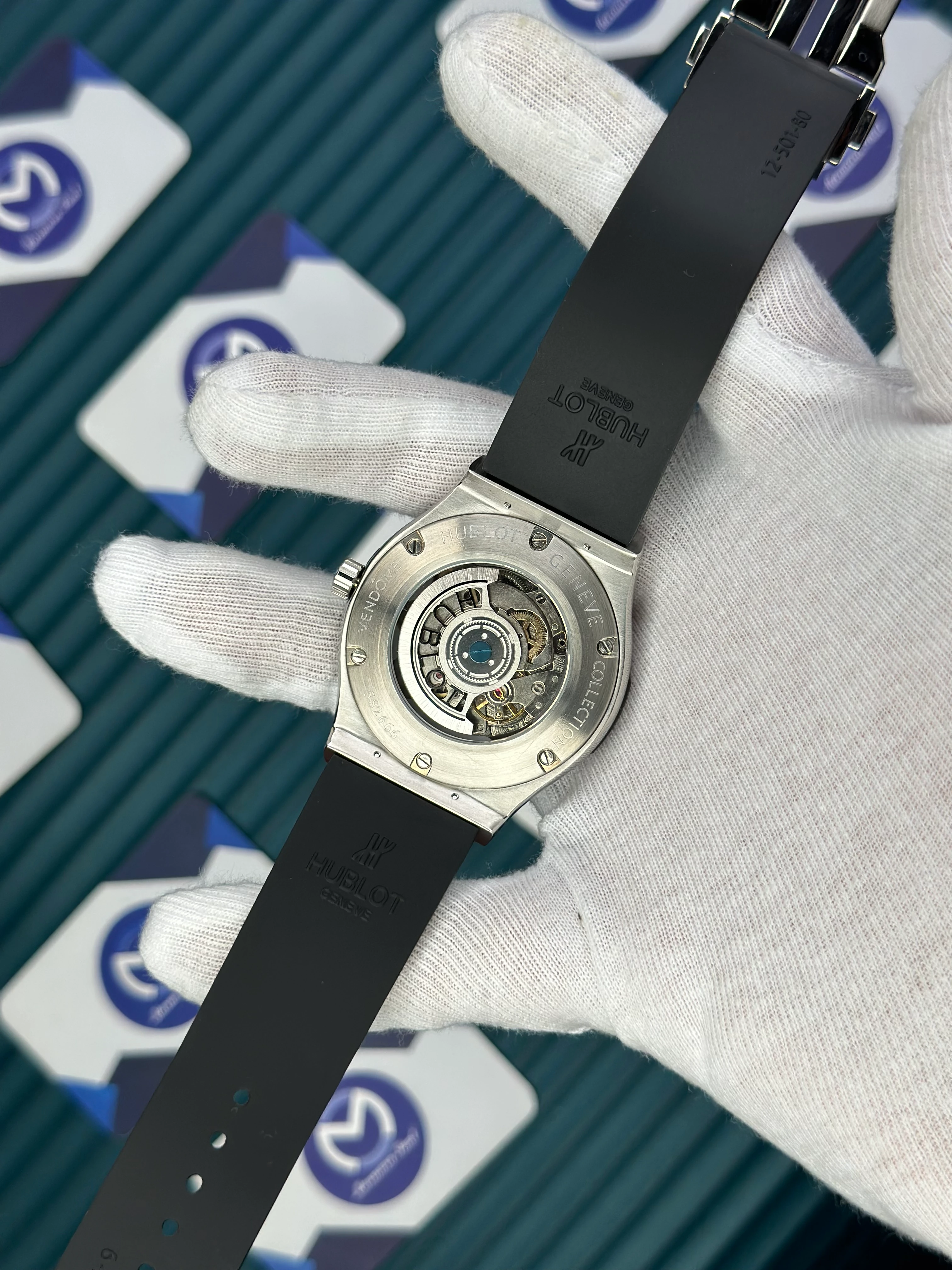 HUBLOT GENEVE AUTOMATIC VENDOME BLACK DIAL SILVER CASE BLACK BEZEL BLACK RUBBER CORD 