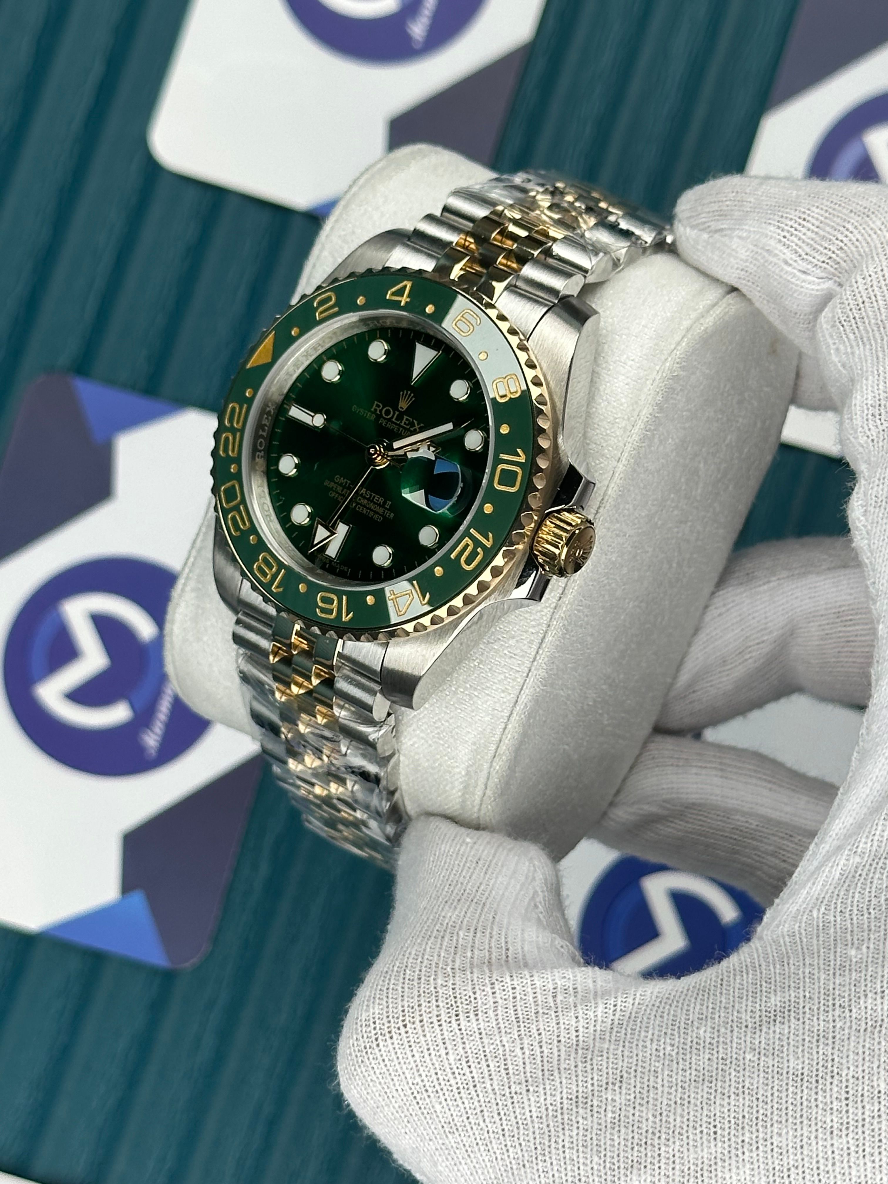 ROLEX GMT MASTER II GREEN DIAL AND BEZEL GOLD-SILVER JUBILE