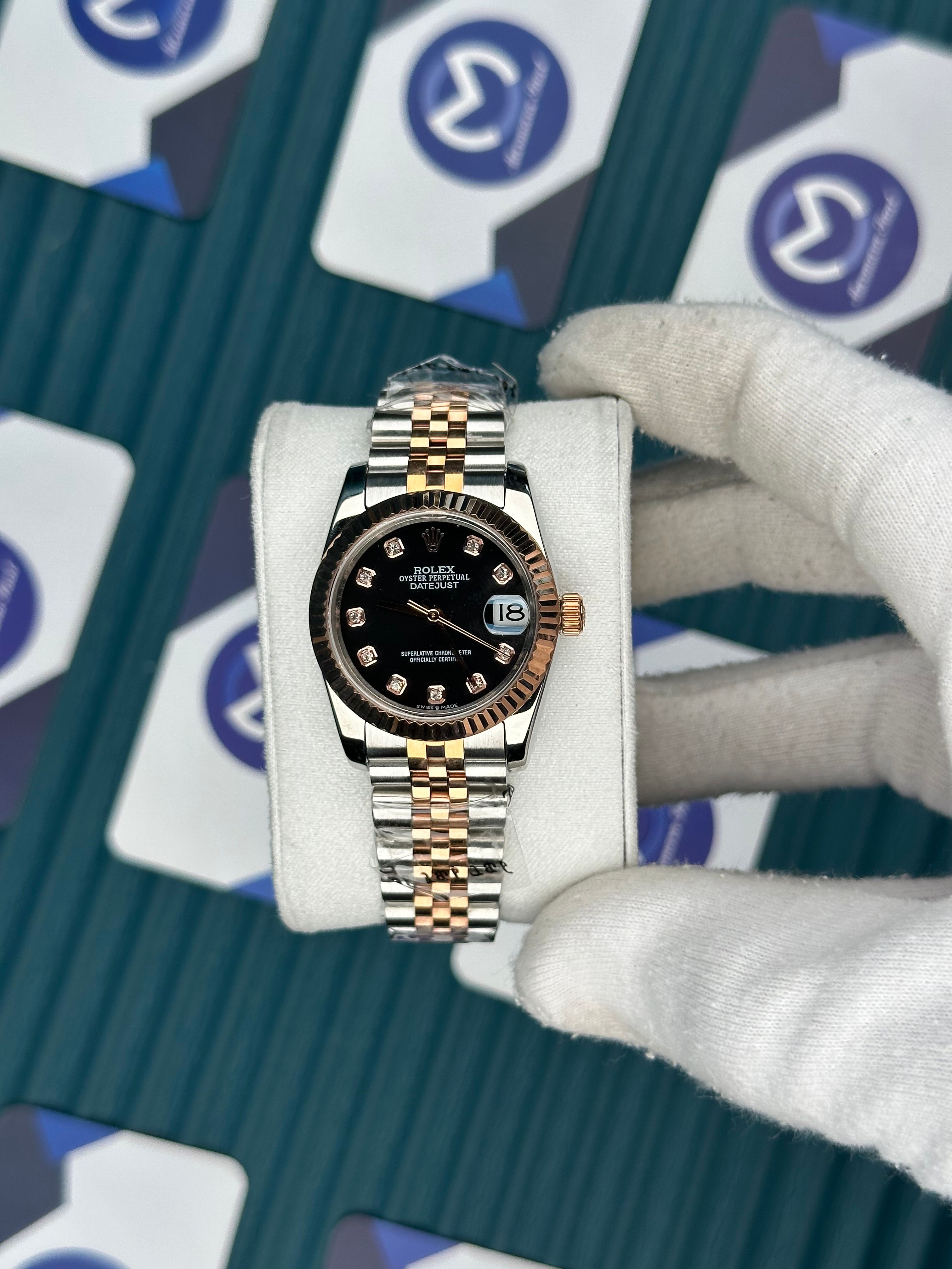 ROLEX 31 BLACK DIAL ROSE-SILVER JUBILEE