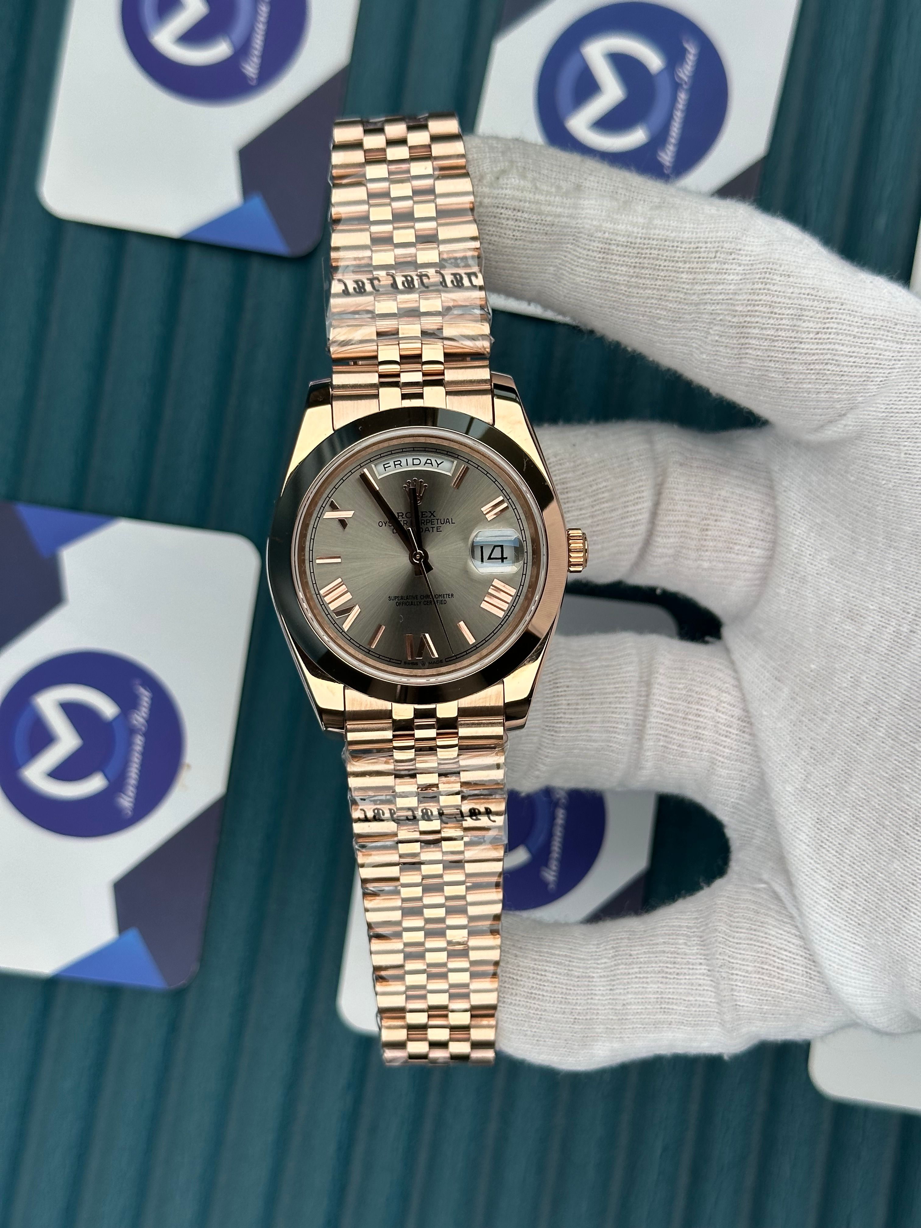 ROLEX DAY-DATE GREY DIAL OVAL BEZEL ROSE ROMA INDEX ROSE JUBILE