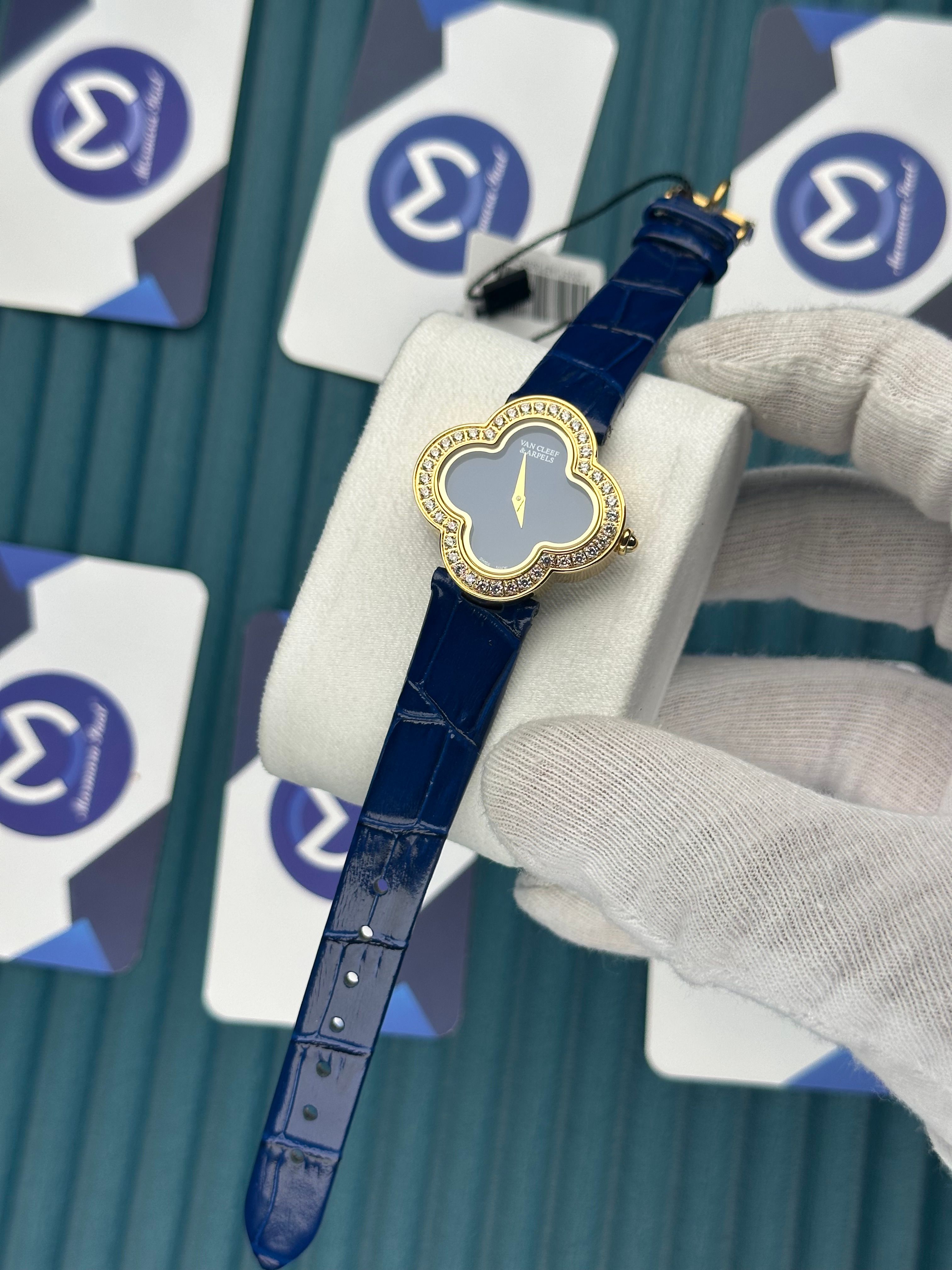 VAN CLEEF & ARPELS BLUE DIAL DIAMOND BEZEL GOLD CASE BLUE LEATHER CORD