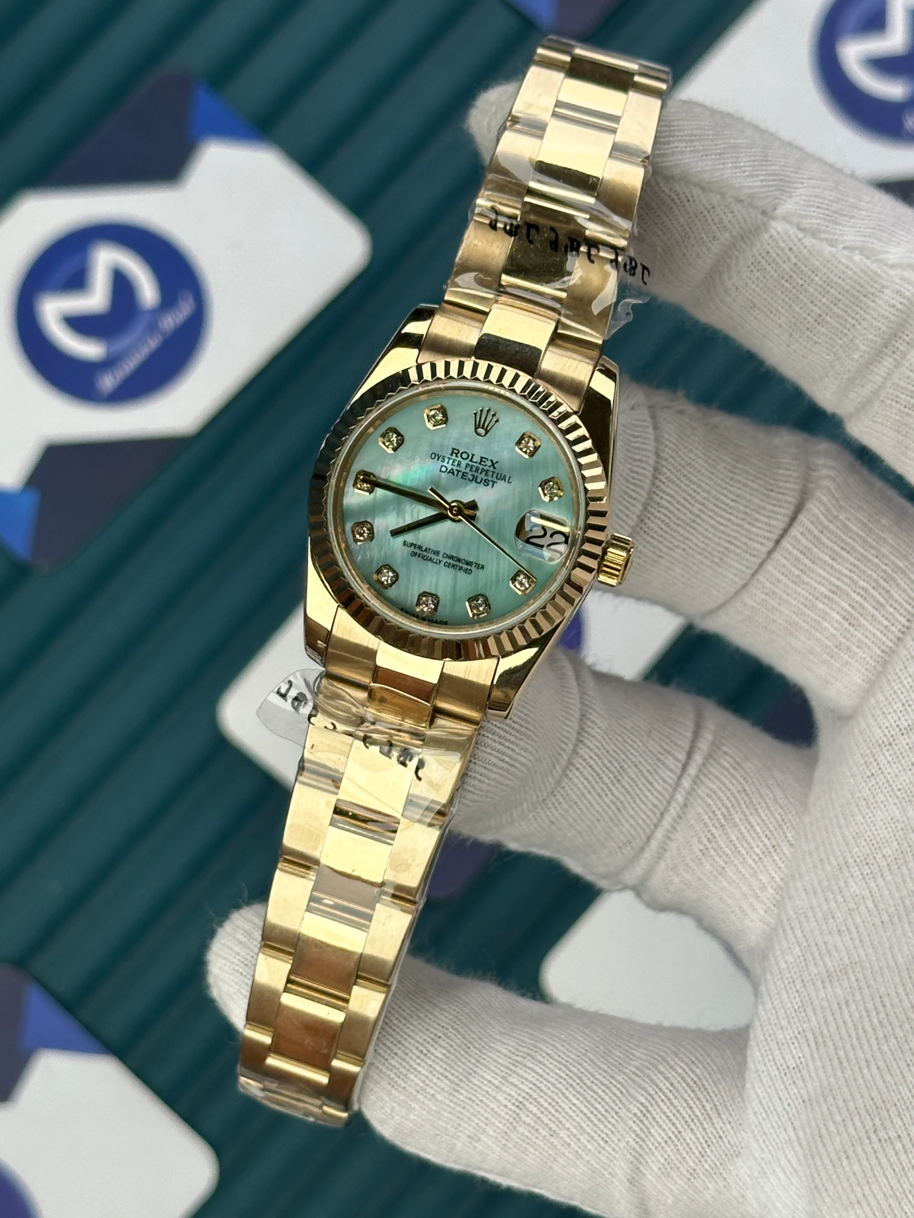 ROLEX 31 MM DATEJUST PEARLESCENT TURQUOISE DIAL DIAMOND INDEX GOLD OYSTER 