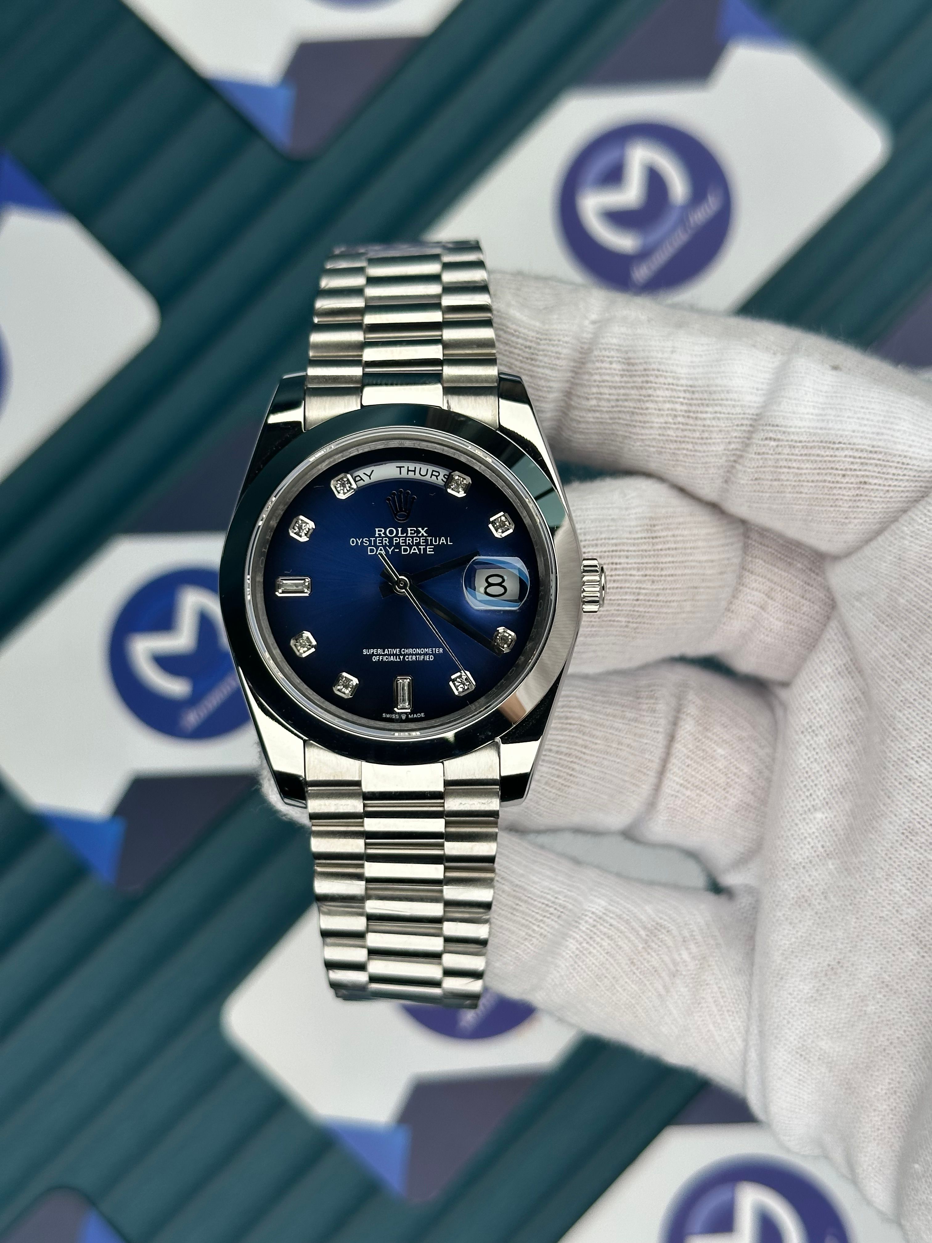 ROLEX DAY-DATE BLUE DIAL OVAL BEZEL DIAMOND INDEX SILVER PRESIDENT