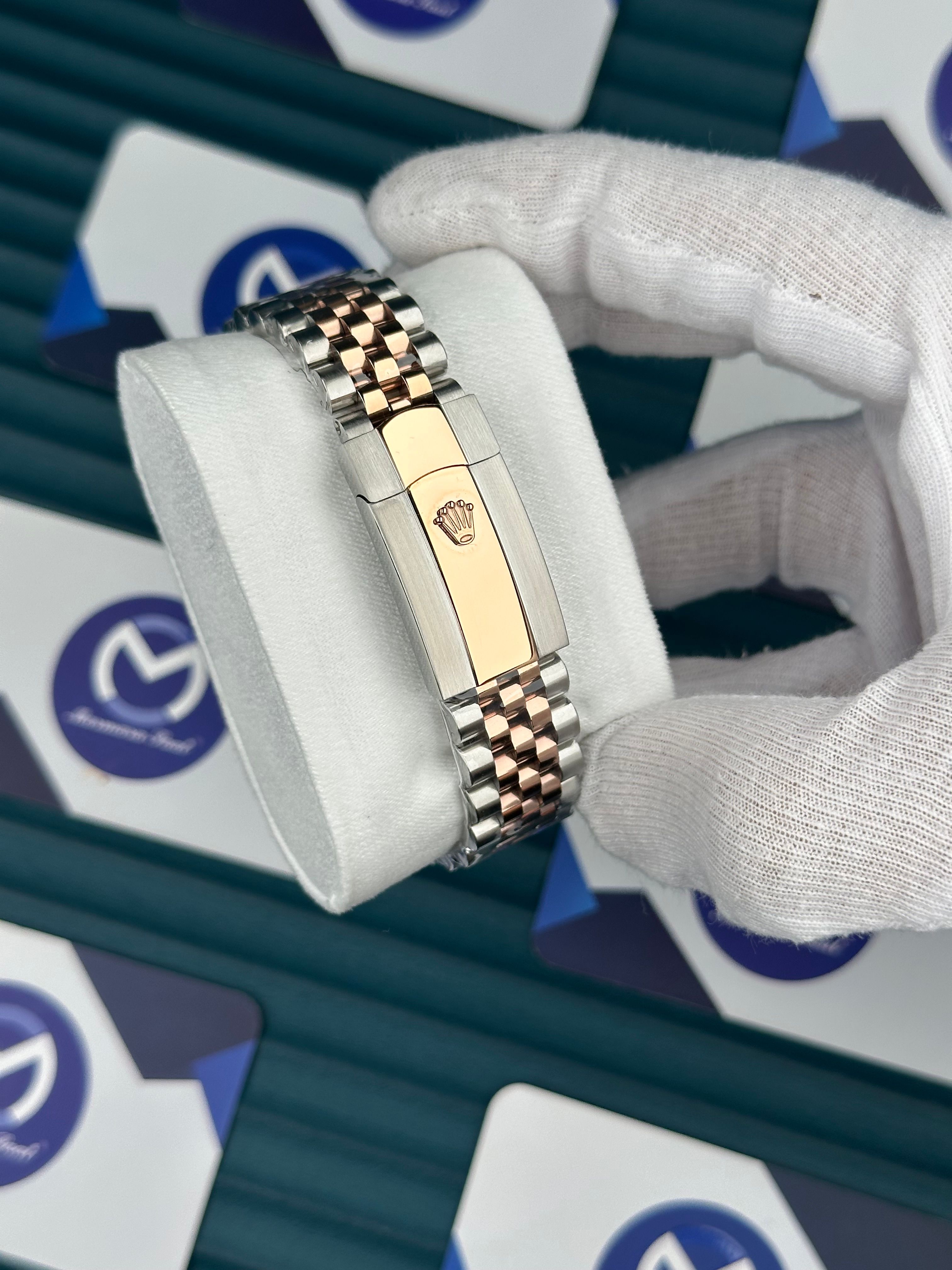ROLEX DAY-DATE CHOCOLATE DIAL DIAMOND INDEX OVAL BEZEL ROSE-SILVER JUBILE