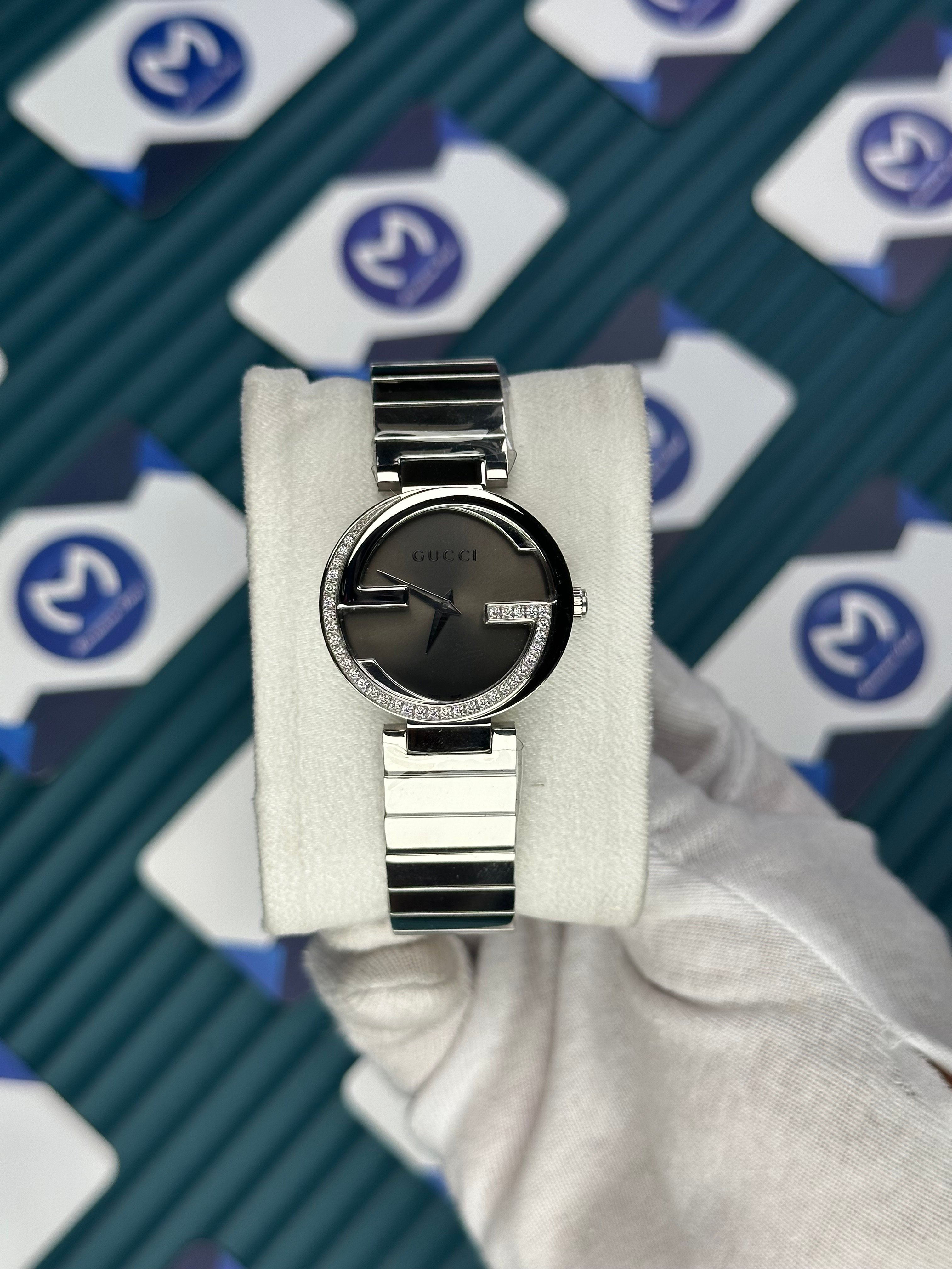 GUCCI WOMAN GREY DIAL G CASE DIAMOND DIAL SILVER CORD