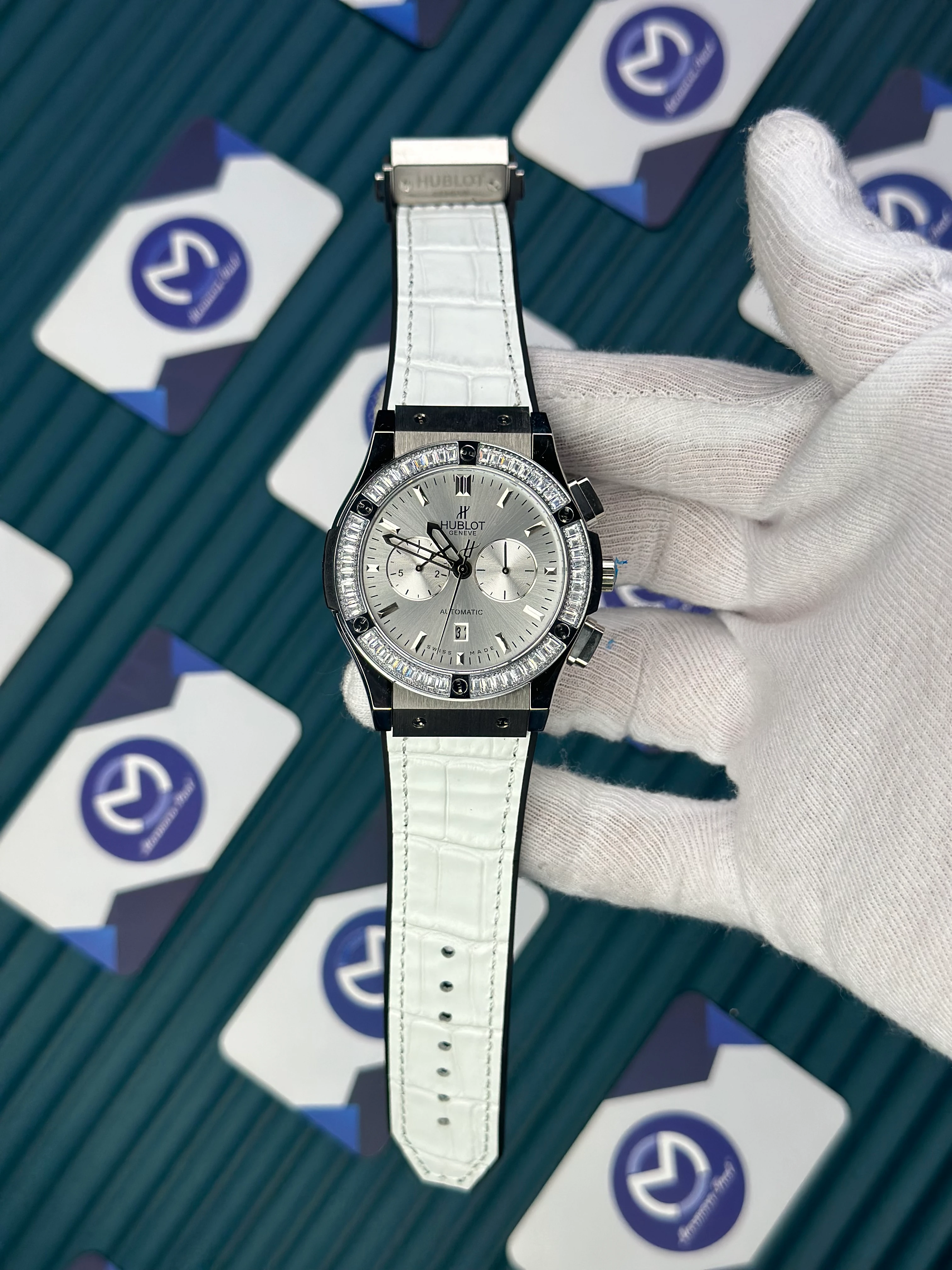 HUBLOT AUTOMATIC WHITE CHRONOGRAPH DIAL DIAMOND BEZEL WHITE LEATHER CORD 