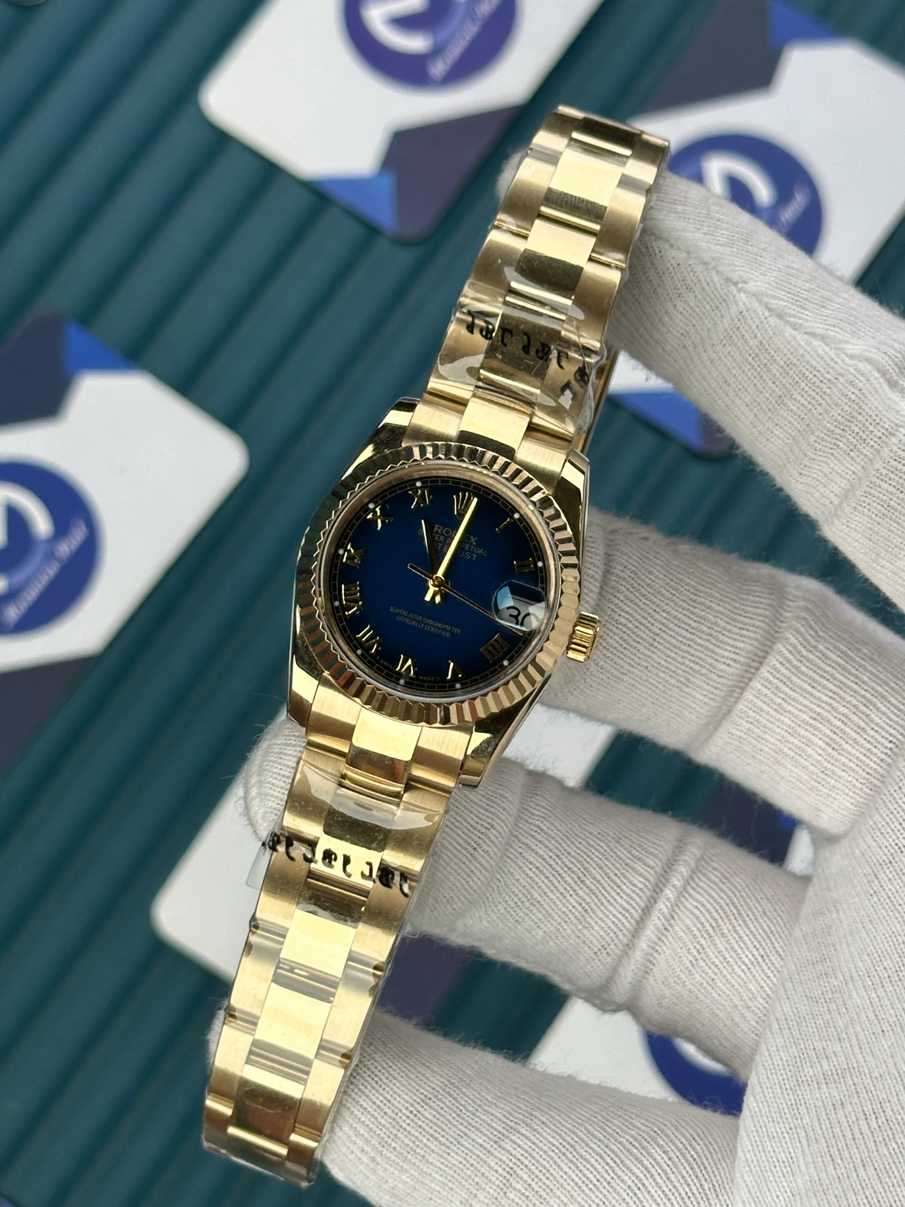ROLEX 31 MM DATEJUST BLUE DIAL ROMA INDEX GOLD OYSTER 