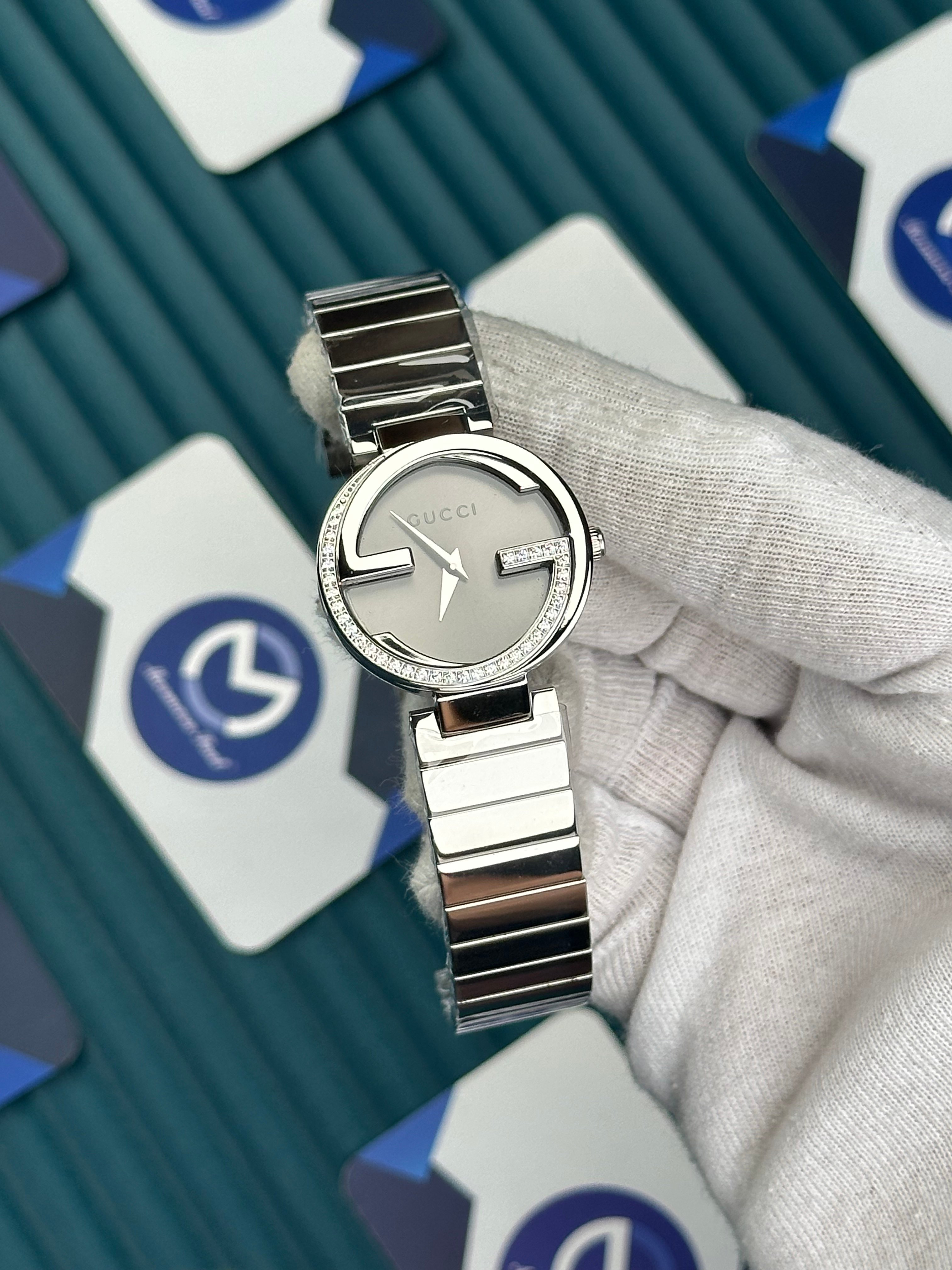 GUCCI WOMAN GREY DIAL G CASE DIAMOND DIAL SILVER CORD
