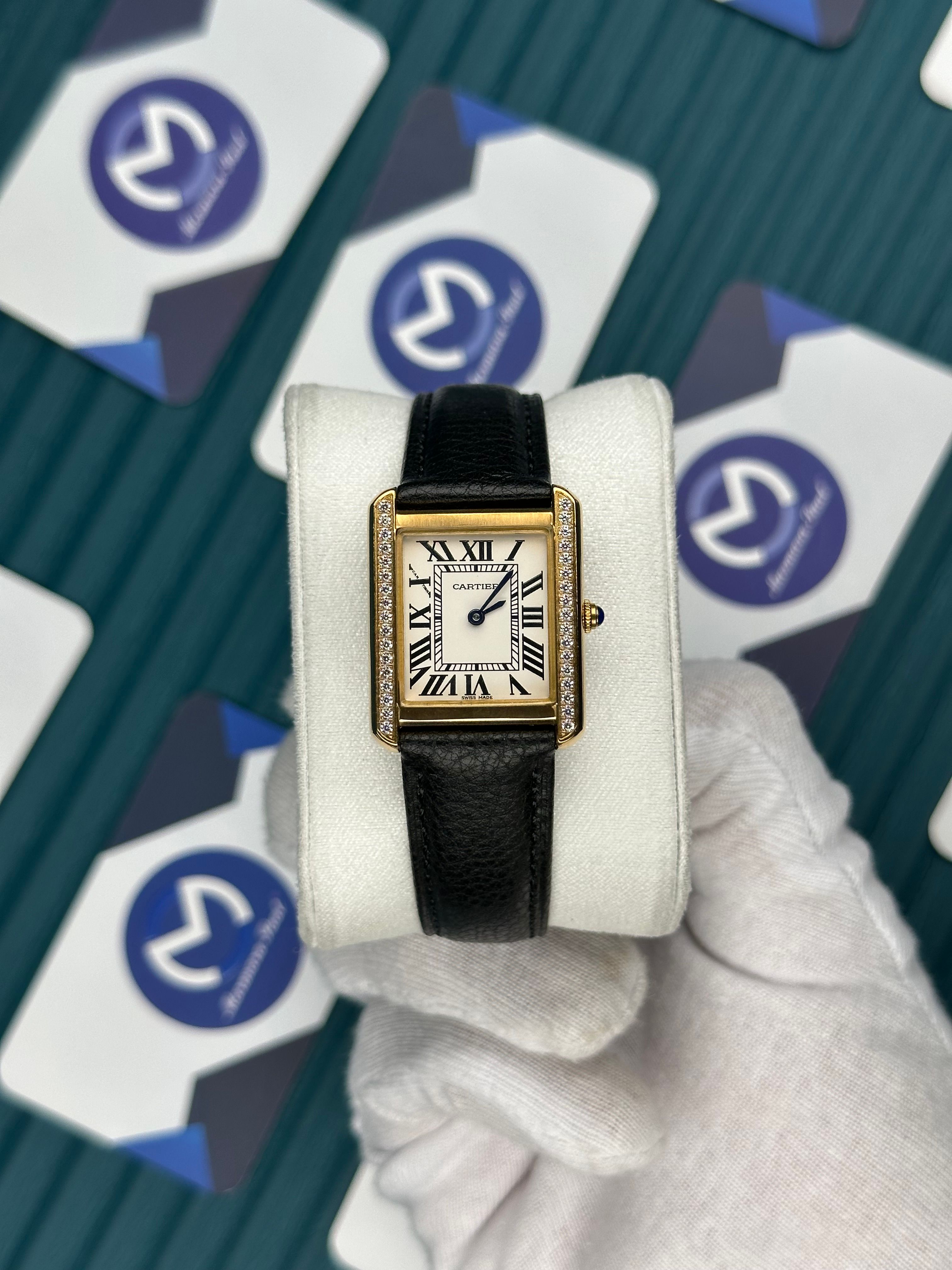 CARTIER WOMAN TANK WHITE DIAL GOLD DIAMOND BEZEL BLACK LEATHER CORD