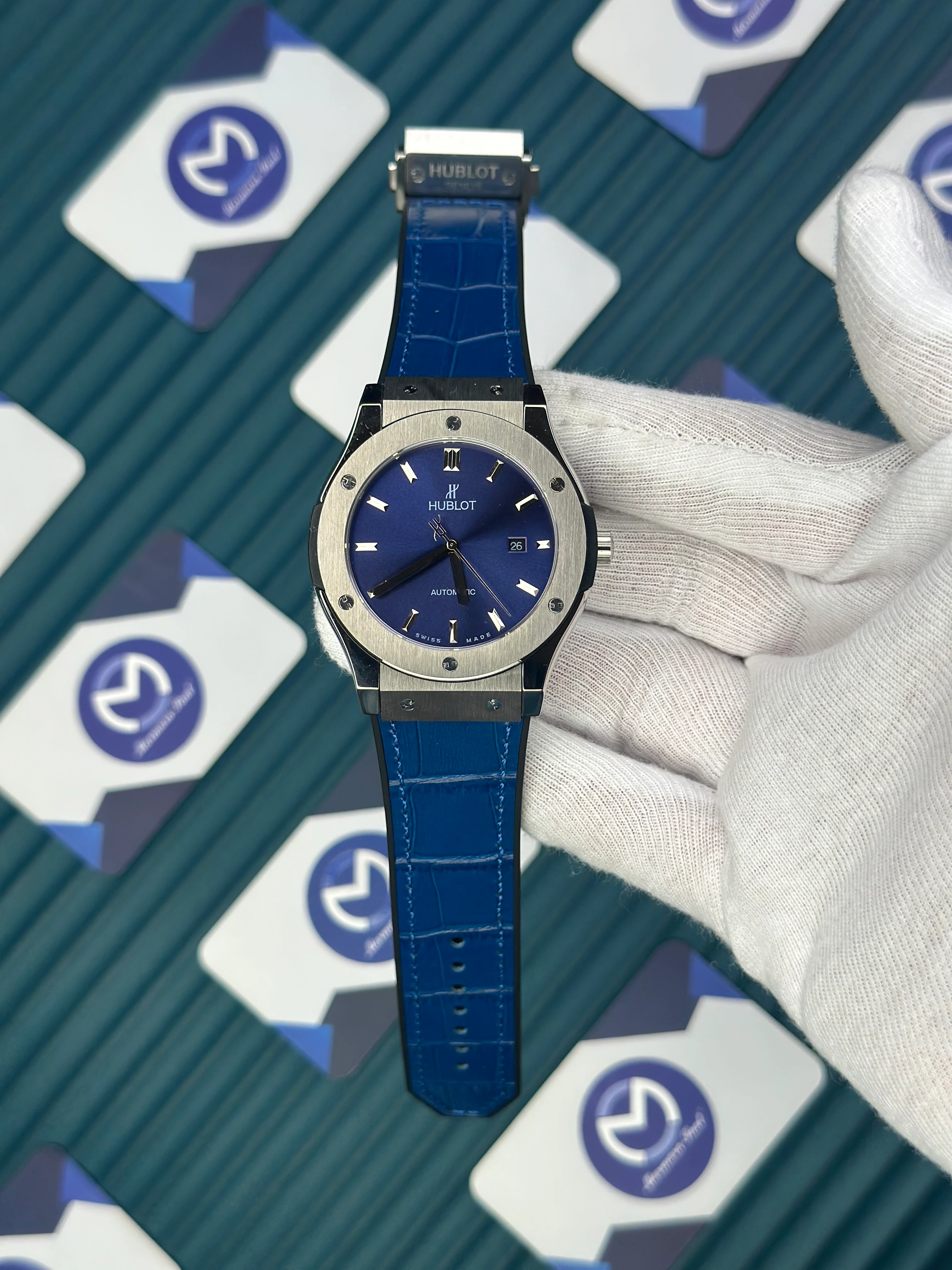 HUBLOT GENEVE AUTOMATIC VENDOME BLUE DIAL SILVER CASE BLUE LEATHER CORD 