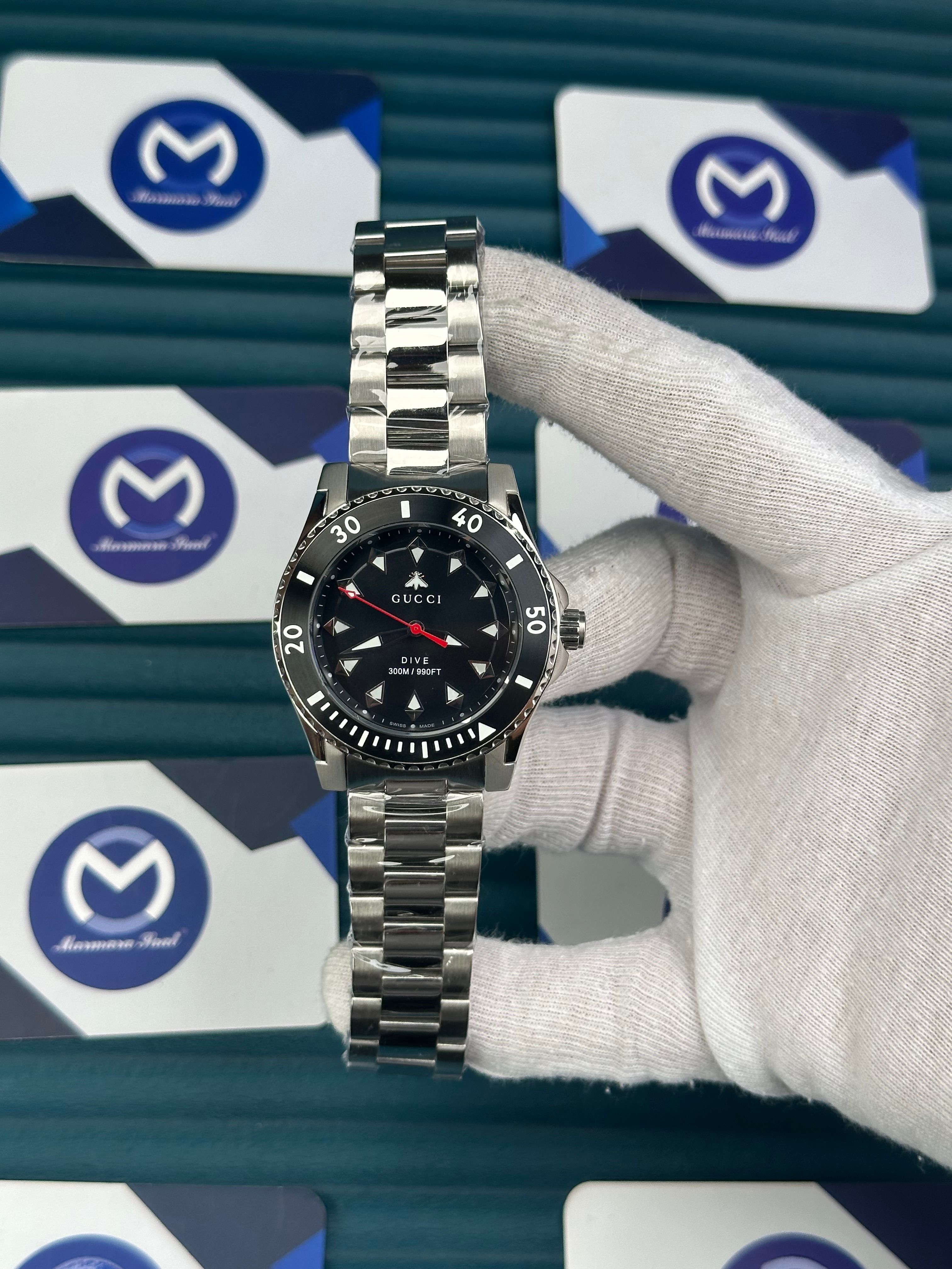 GUCCI BLACK DIAL TRIANGLE INDEX SILVER CORD