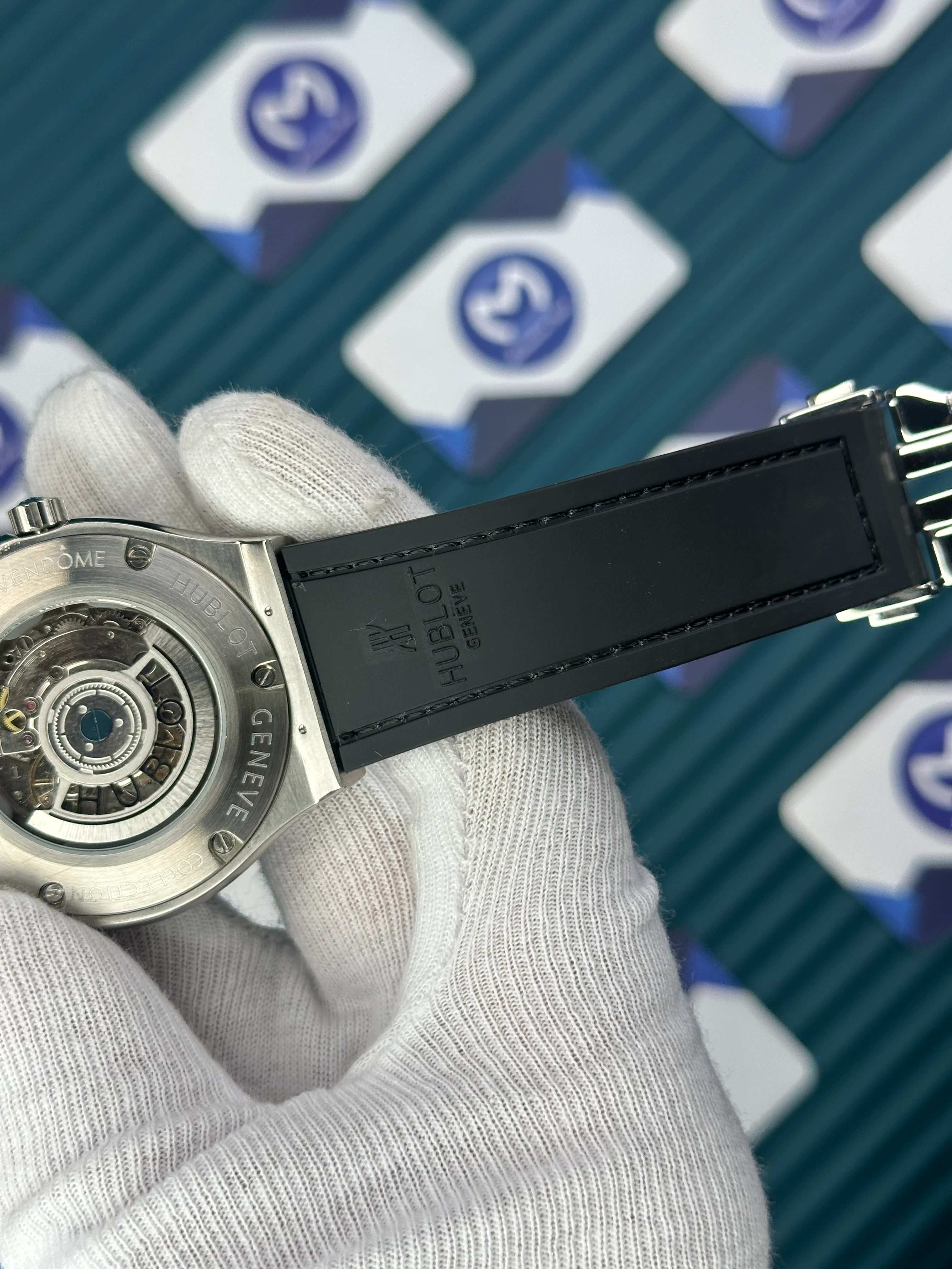 HUBLOT GENEVE AUTOMATIC BLACK DIAL SILVER CASE BLACK BEZEL BLACK LEATHER CORD 