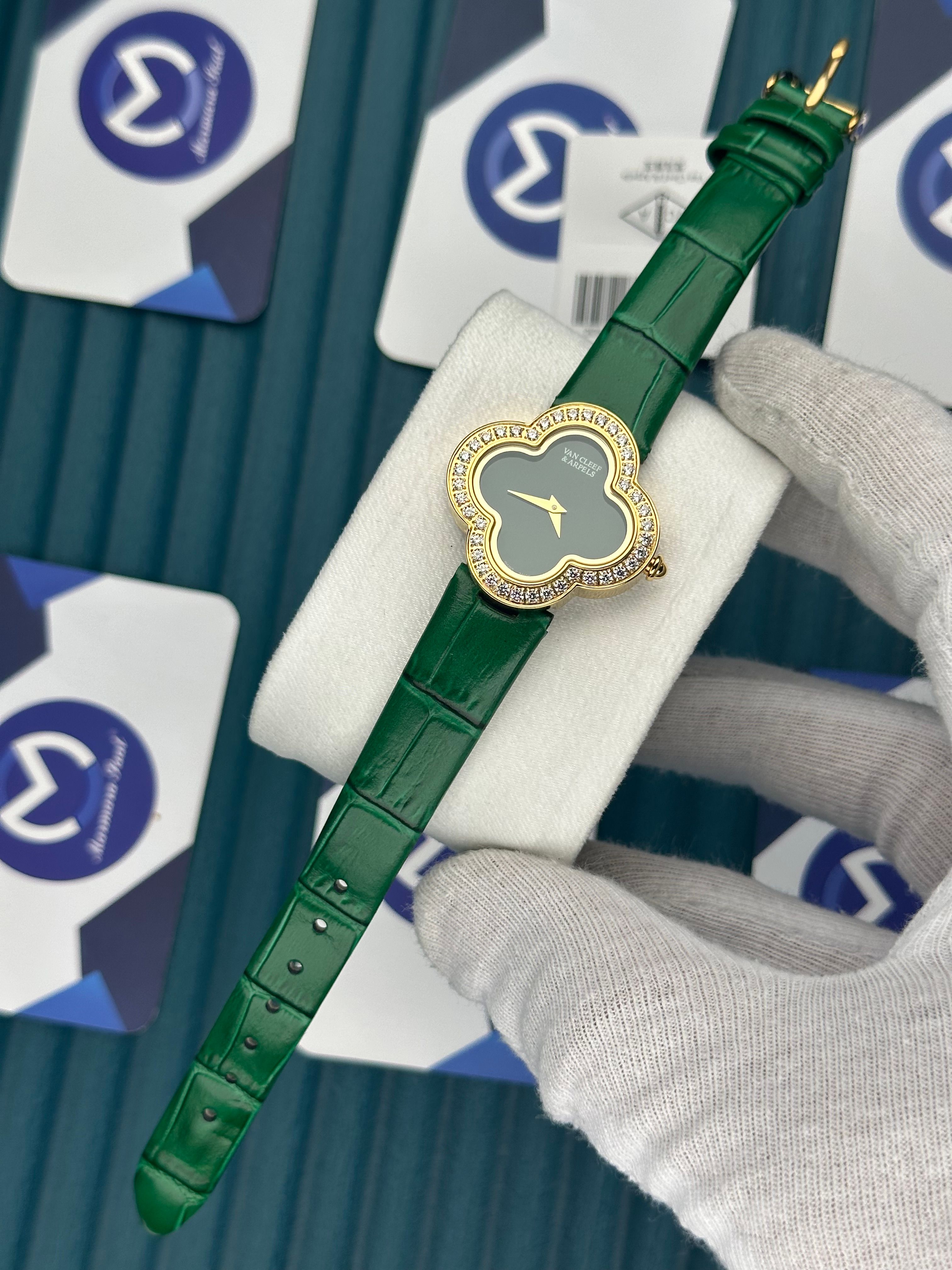 VAN CLEEF & ARPELS GREEN DIAL DIAMOND BEZEL GOLD CASE GREEN LEATHER CORD