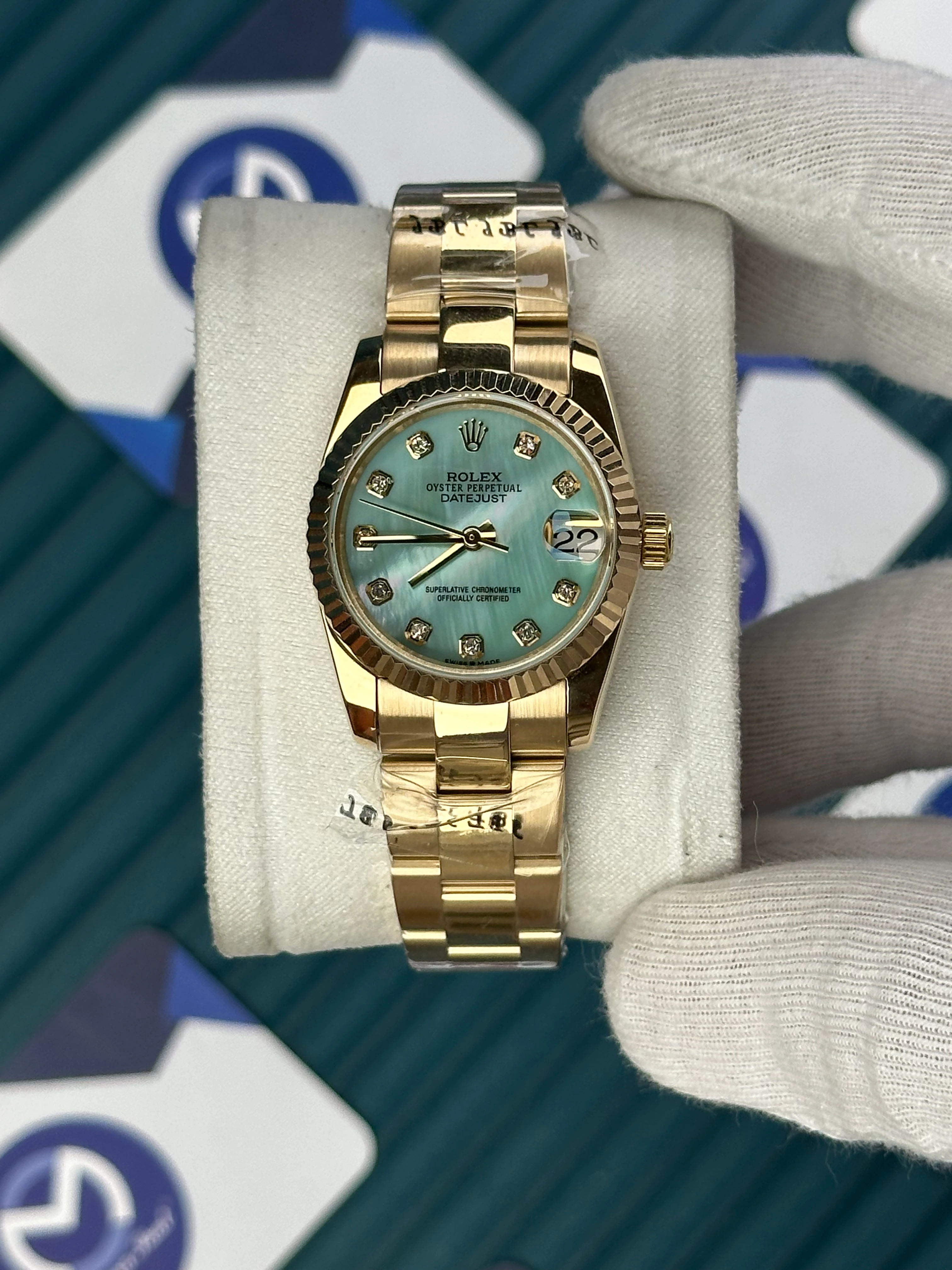 ROLEX 31 MM DATEJUST PEARLESCENT TURQUOISE DIAL DIAMOND INDEX GOLD OYSTER 