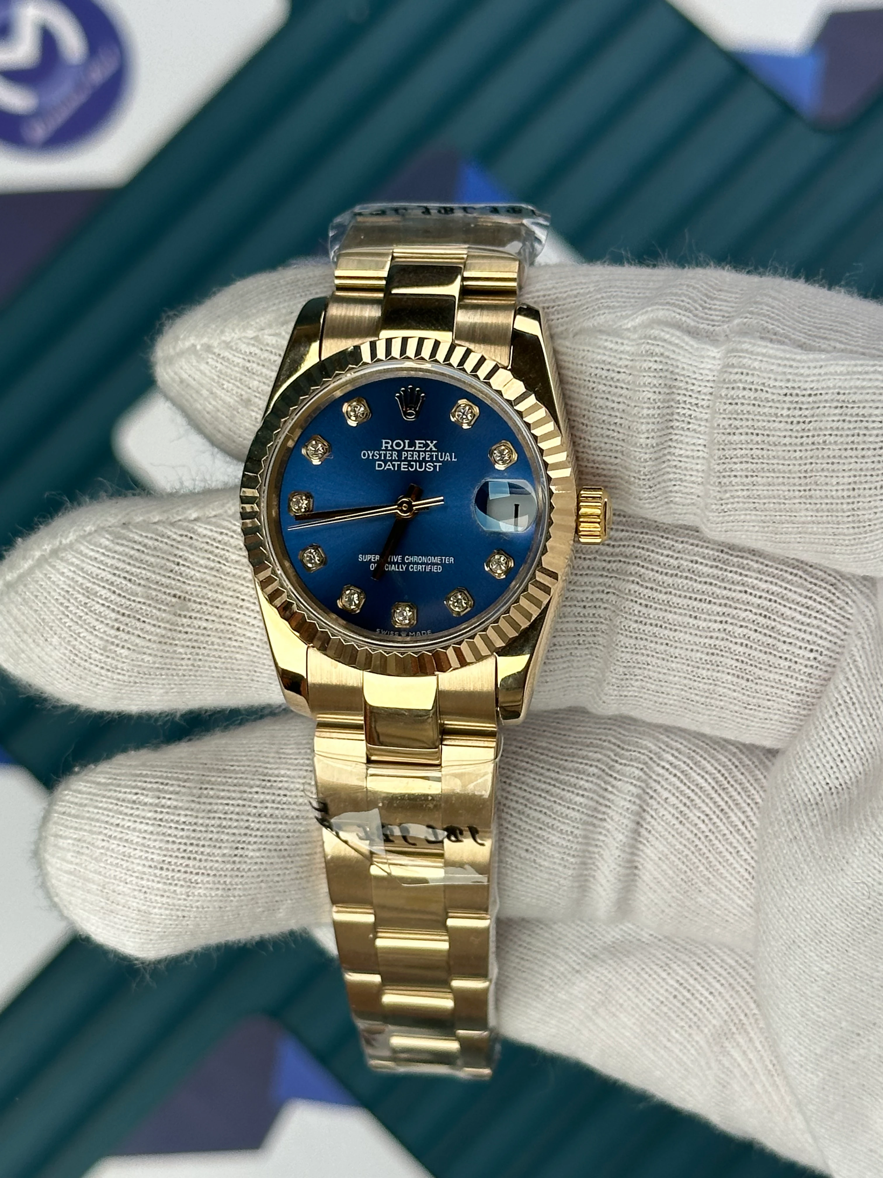 ROLEX 31 MM DATEJUST BLUE DIAL DIAMOND INDEX GOLD OYSTER 