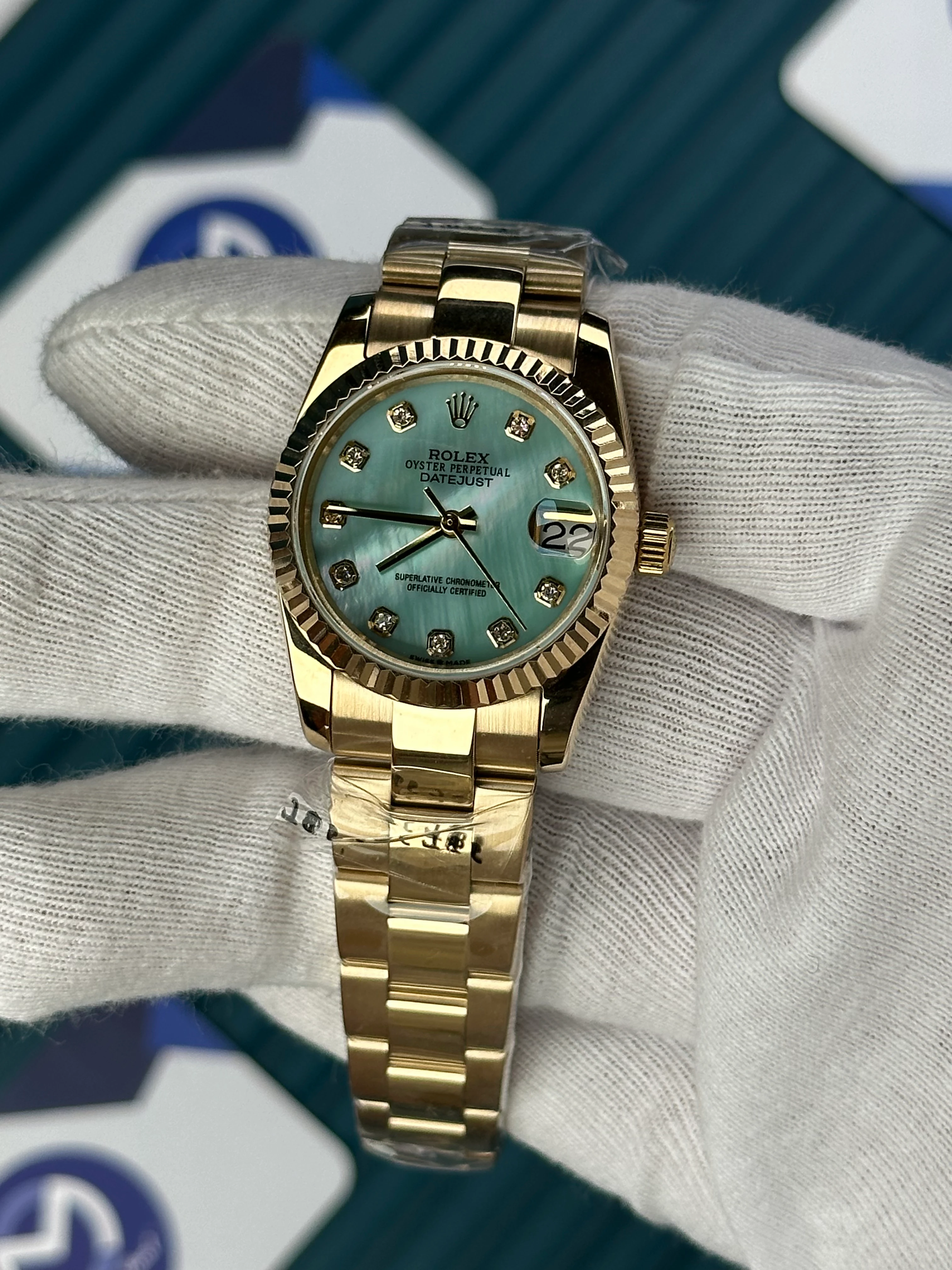 ROLEX 31 MM DATEJUST PEARLESCENT TURQUOISE DIAL DIAMOND INDEX GOLD OYSTER 
