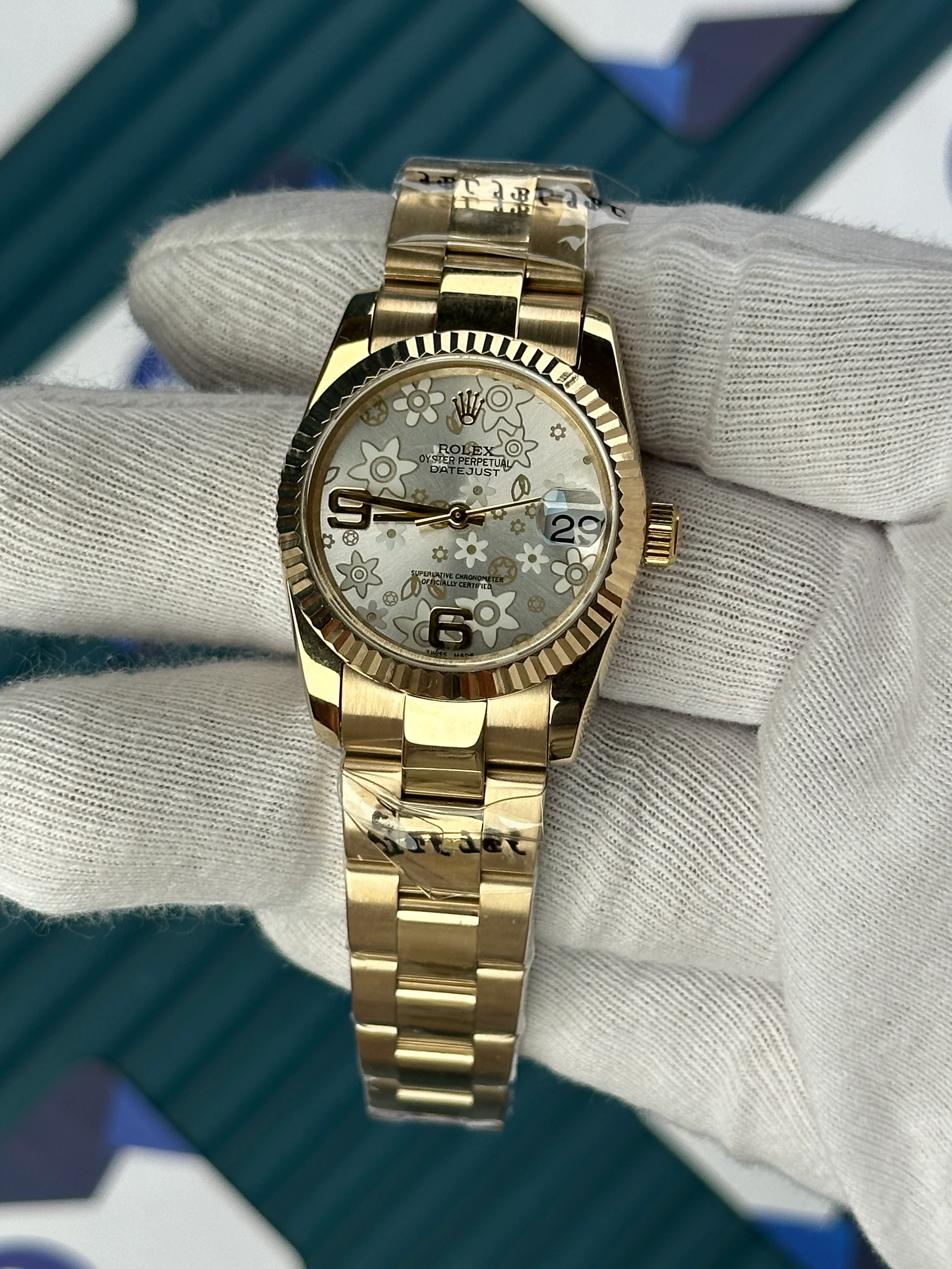 ROLEX 31 MM DATEJUST WHITE FLOWERS PATTERNED DIAL GOLD OYSTER 