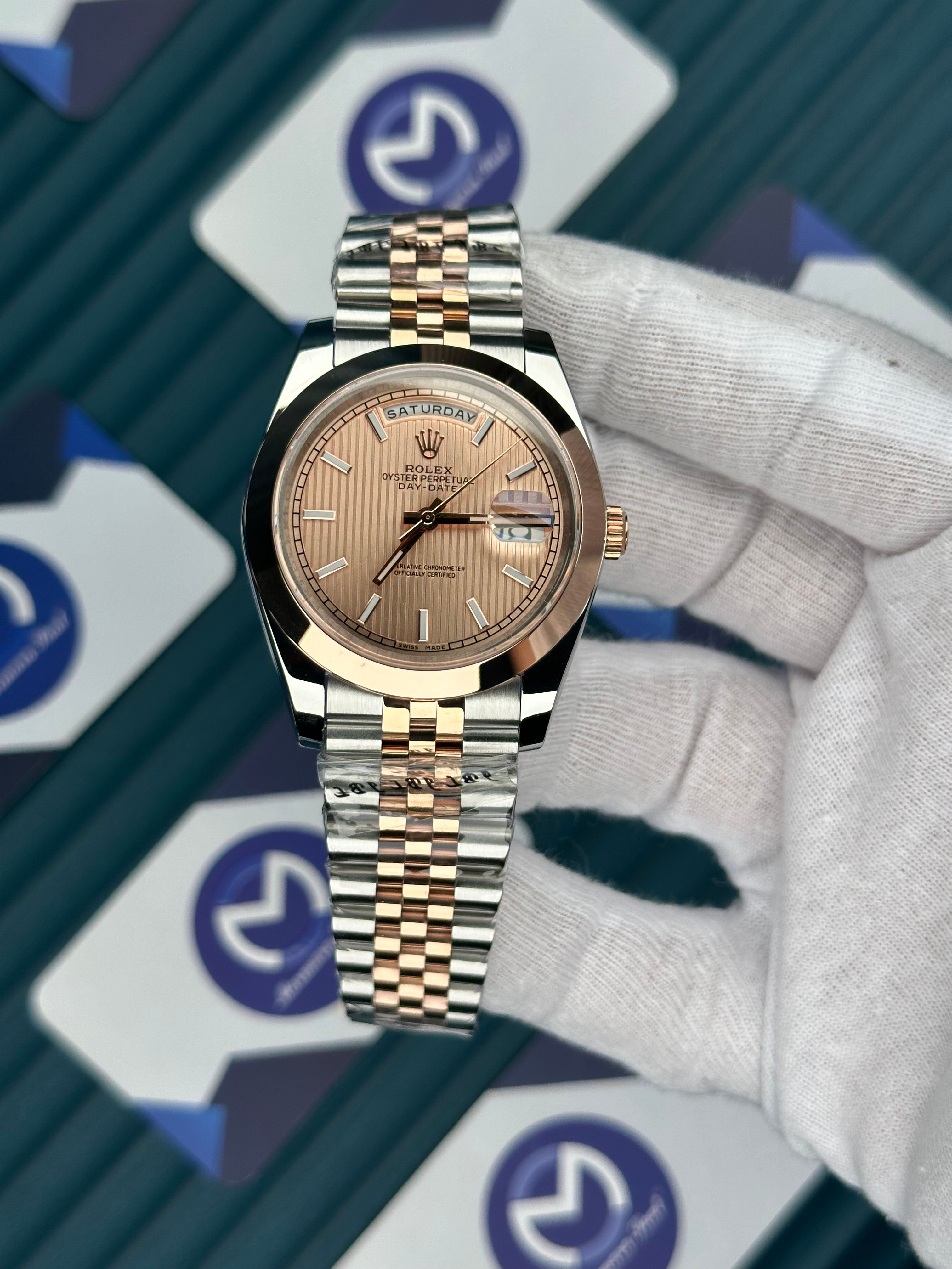 ROLEX DAY-DATE MOZAIK ROSE DIAL OVAL BEZEL ROSE-SILVER JUBILE