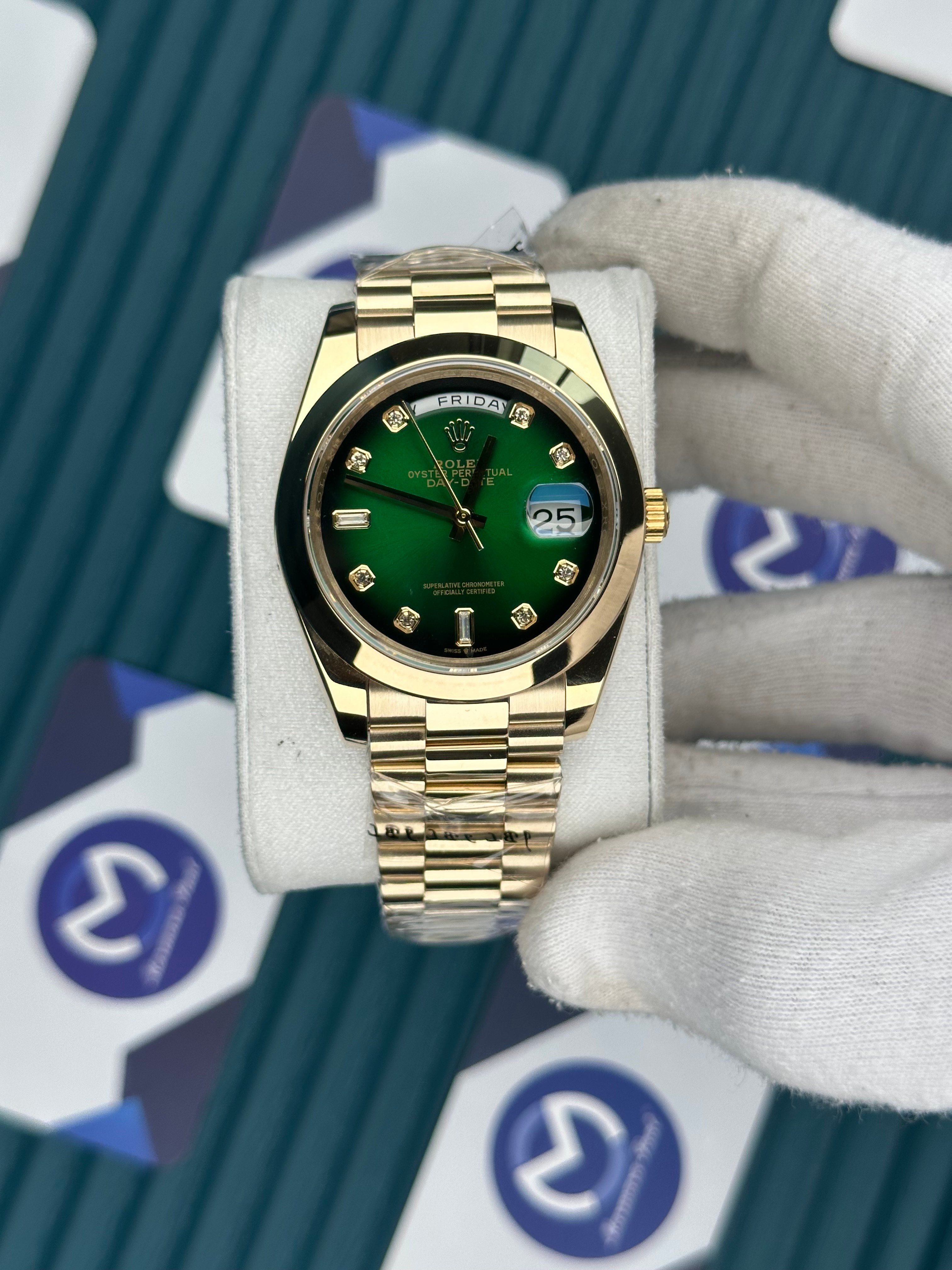 ROLEX DAY-DATE GREEN DIAL OVAL BEZEL DIAMOND INDEX GOLD PRESIDENT